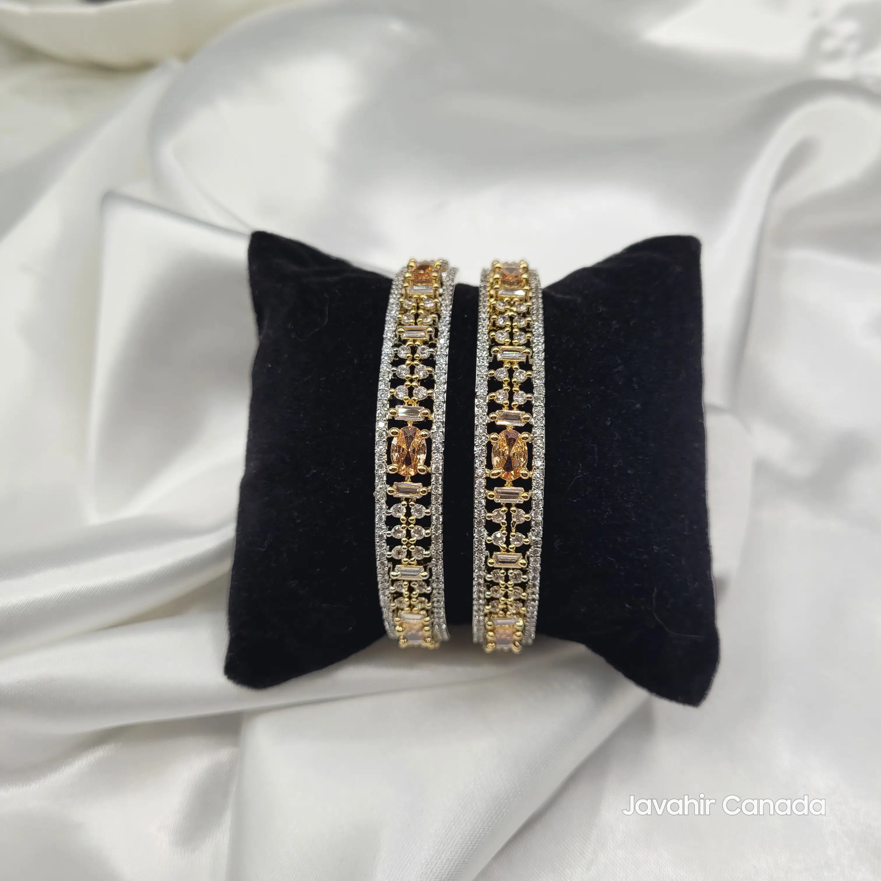 JV3028 Gold Bangles on Black Velvet – Oval and Baguette Stones