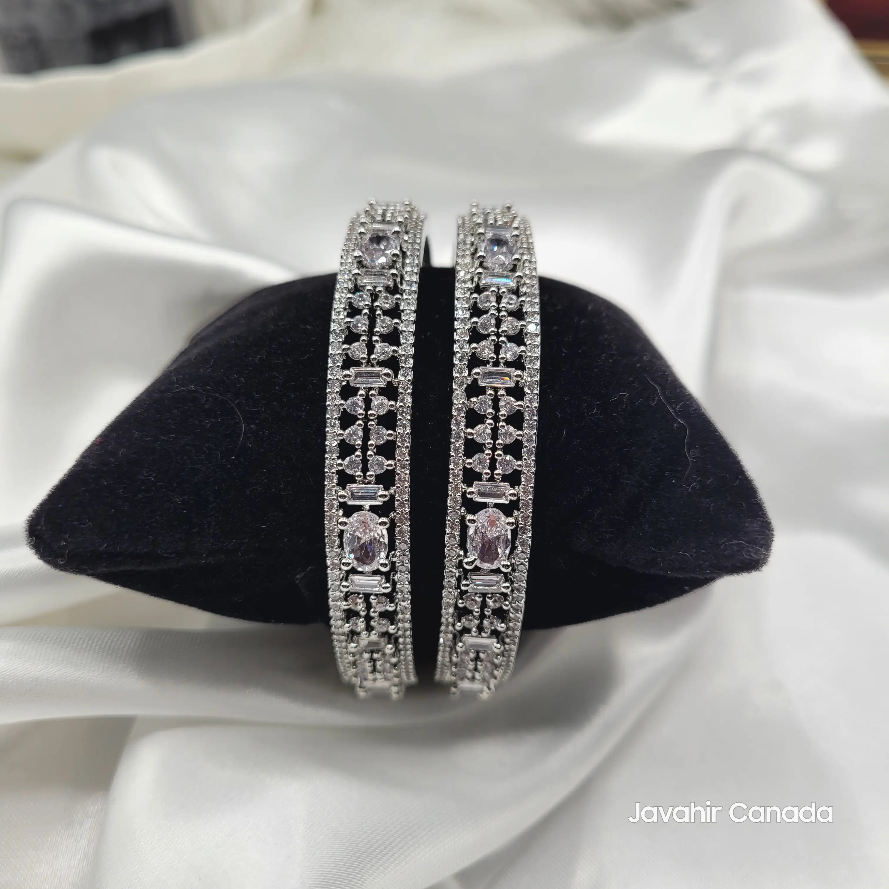 JV3028 Gold Bangles on Black Velvet – Oval and Baguette Stones