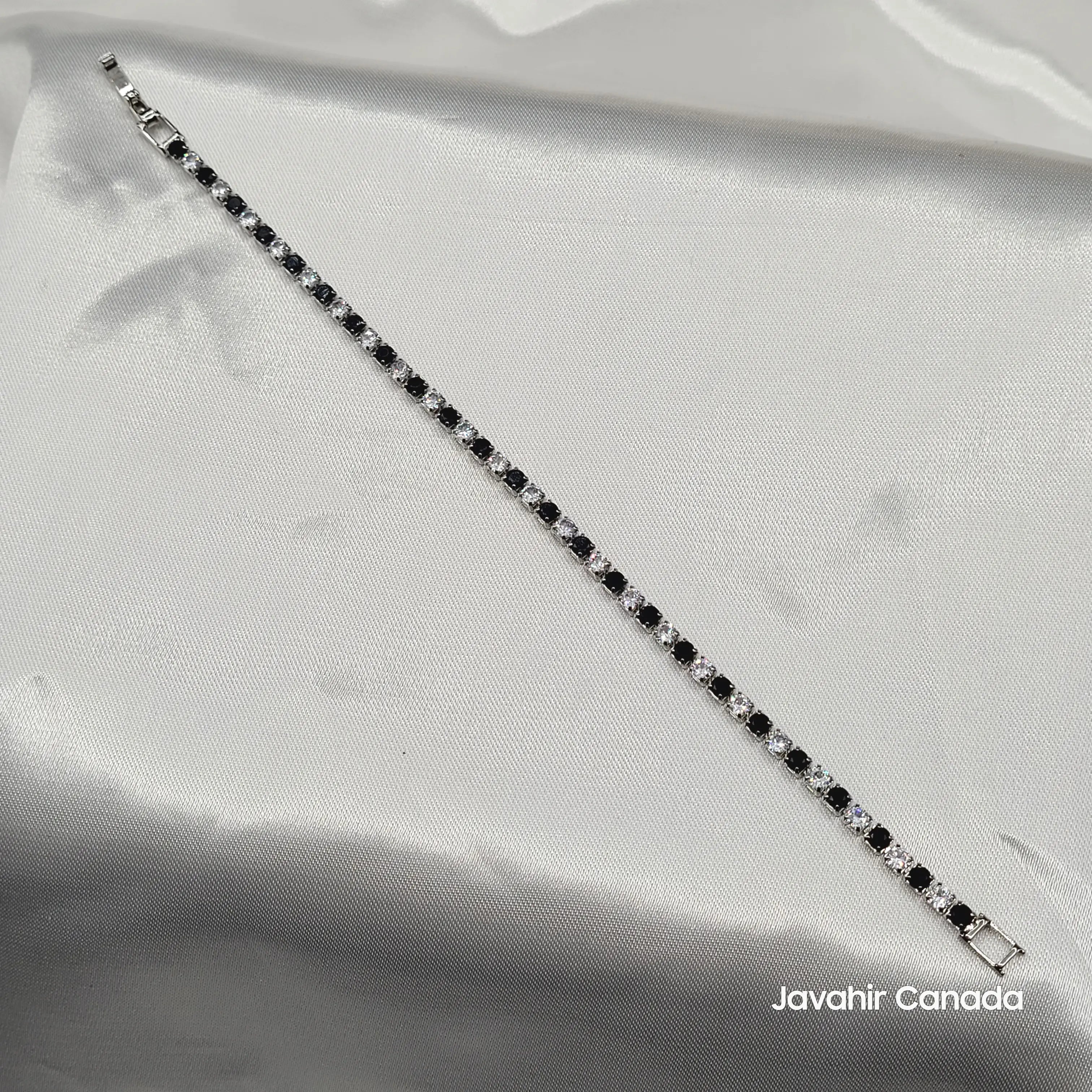 JV4008 tennis bracelet with alternating black and clear CZ stones on silver finish