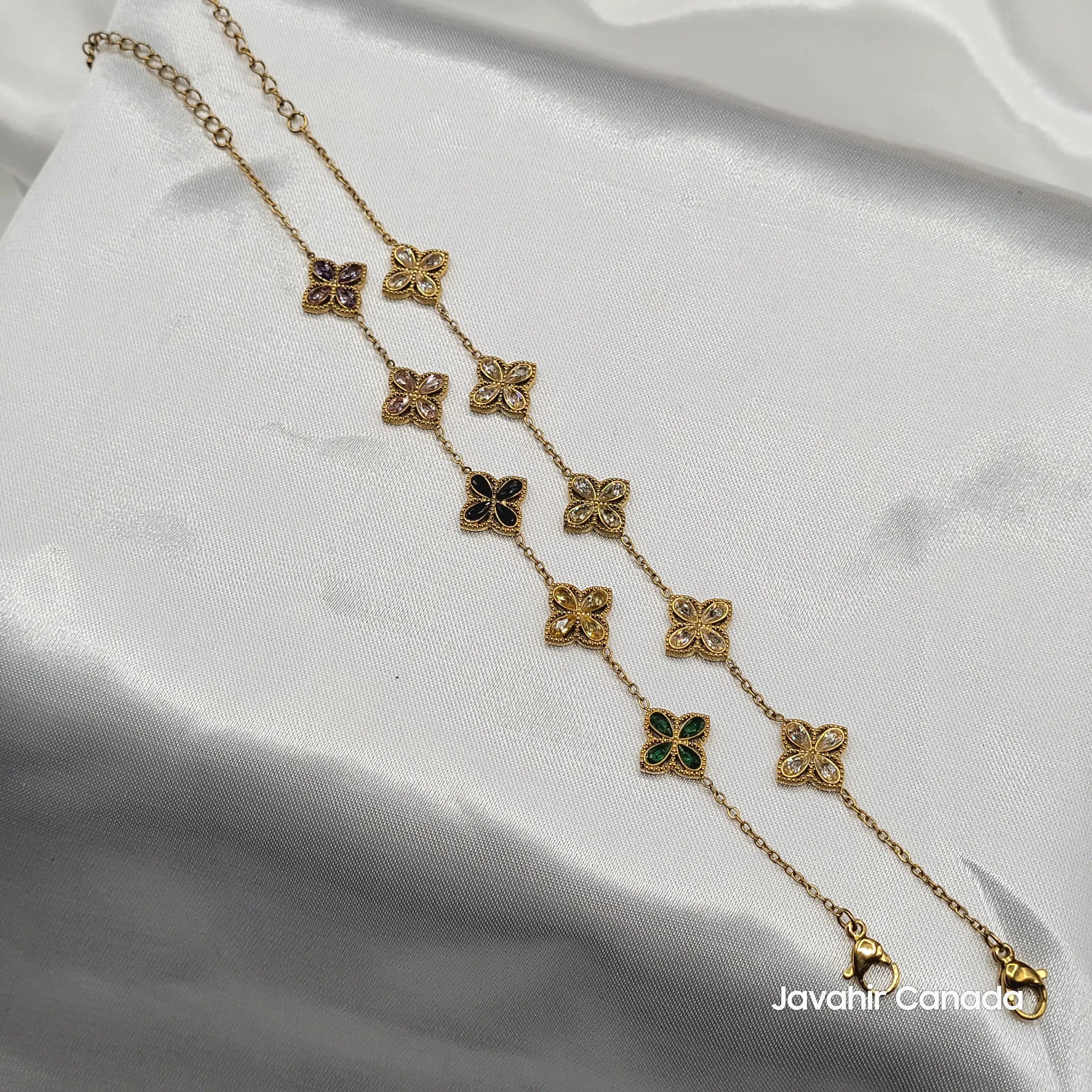 Gold-tone bracelets with floral quatrefoil CZ charms in multicolor and white variants – JV4011