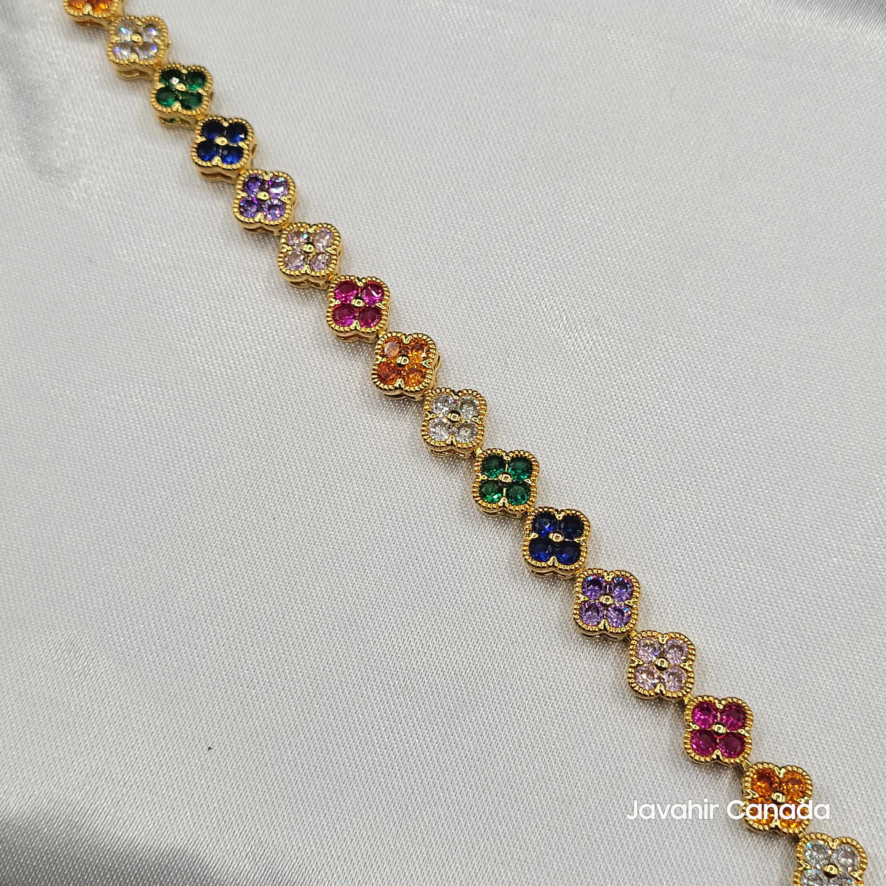 Close-up of JV4013 floral CZ bracelet featuring four-petal multicolor flowers in gold finish