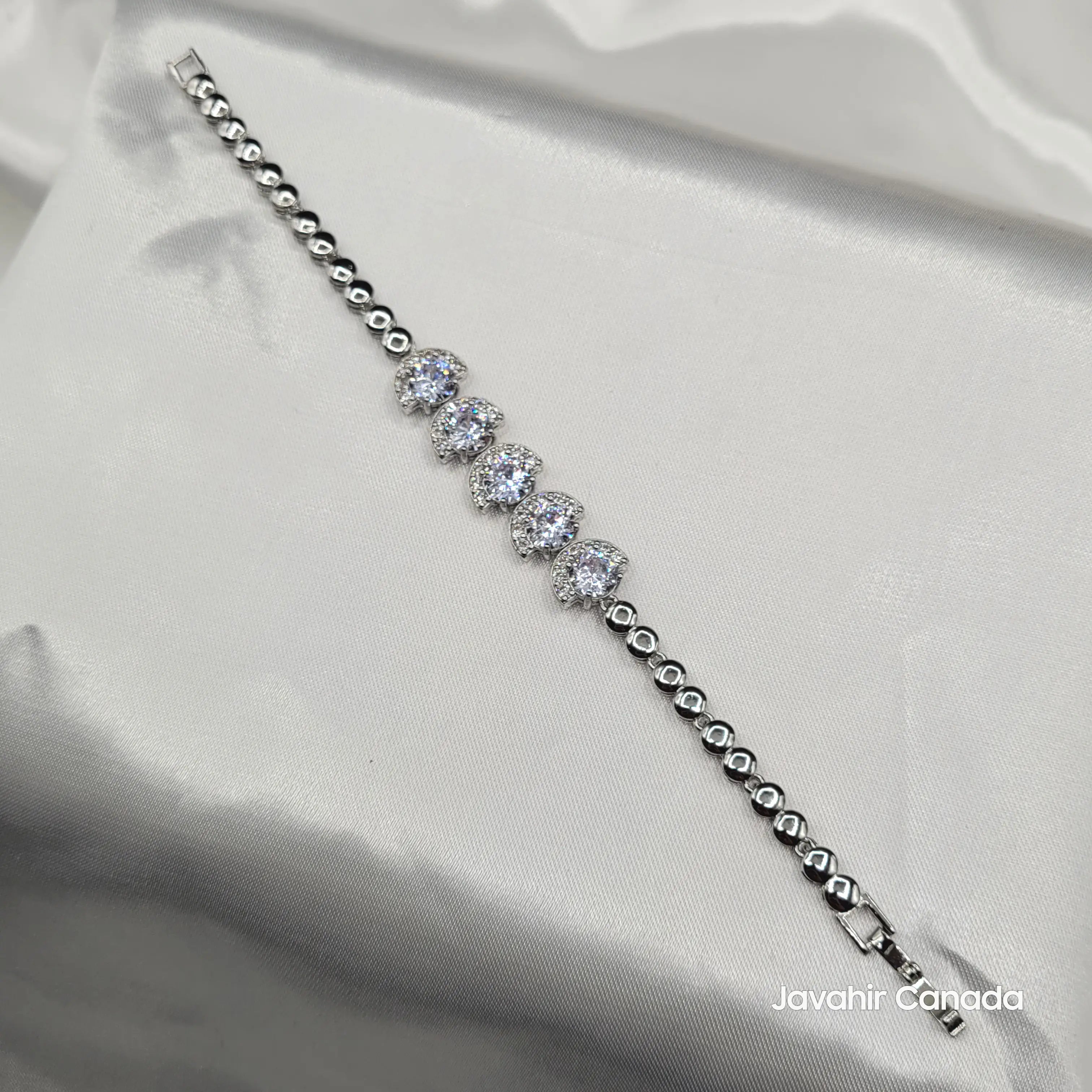 JV4014 silver-tone tennis bracelet with round-cut CZ stones in crescent halo settings