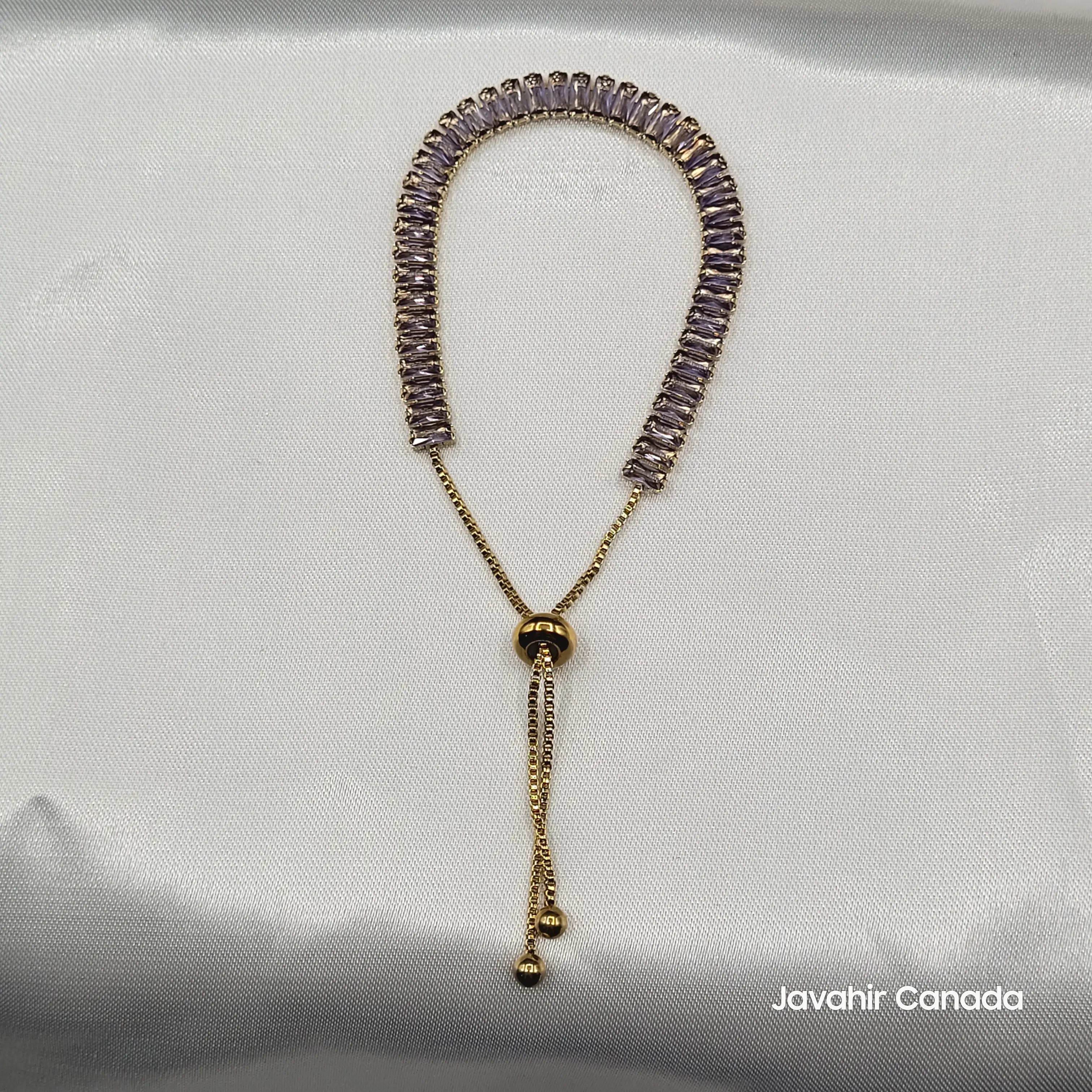 JV4019 adjustable bracelet with gold sliding clasp and purple baguette CZ stones on display