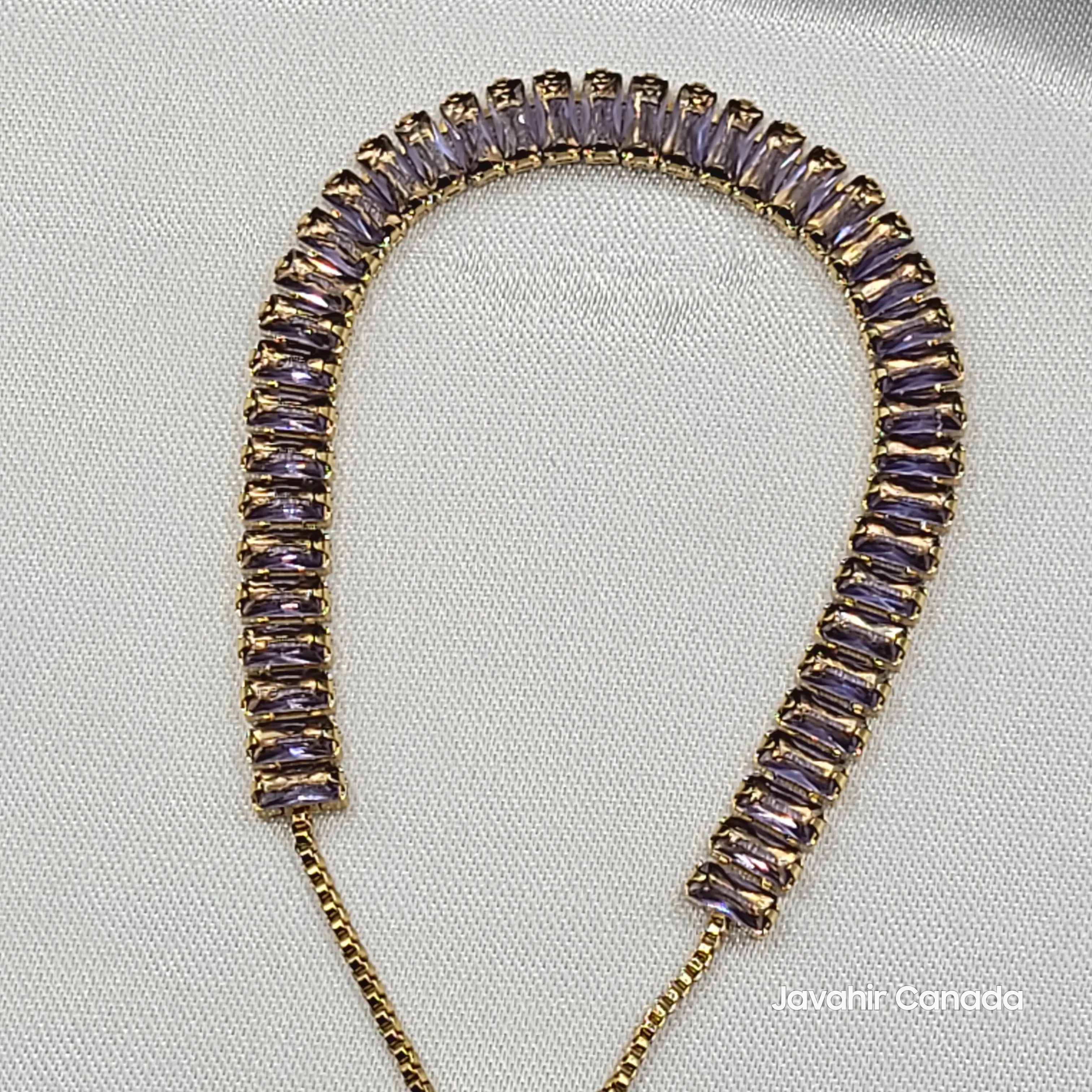 Close-up of JV4019 bracelet with gold-plated finish and baguette-cut purple cubic zirconia