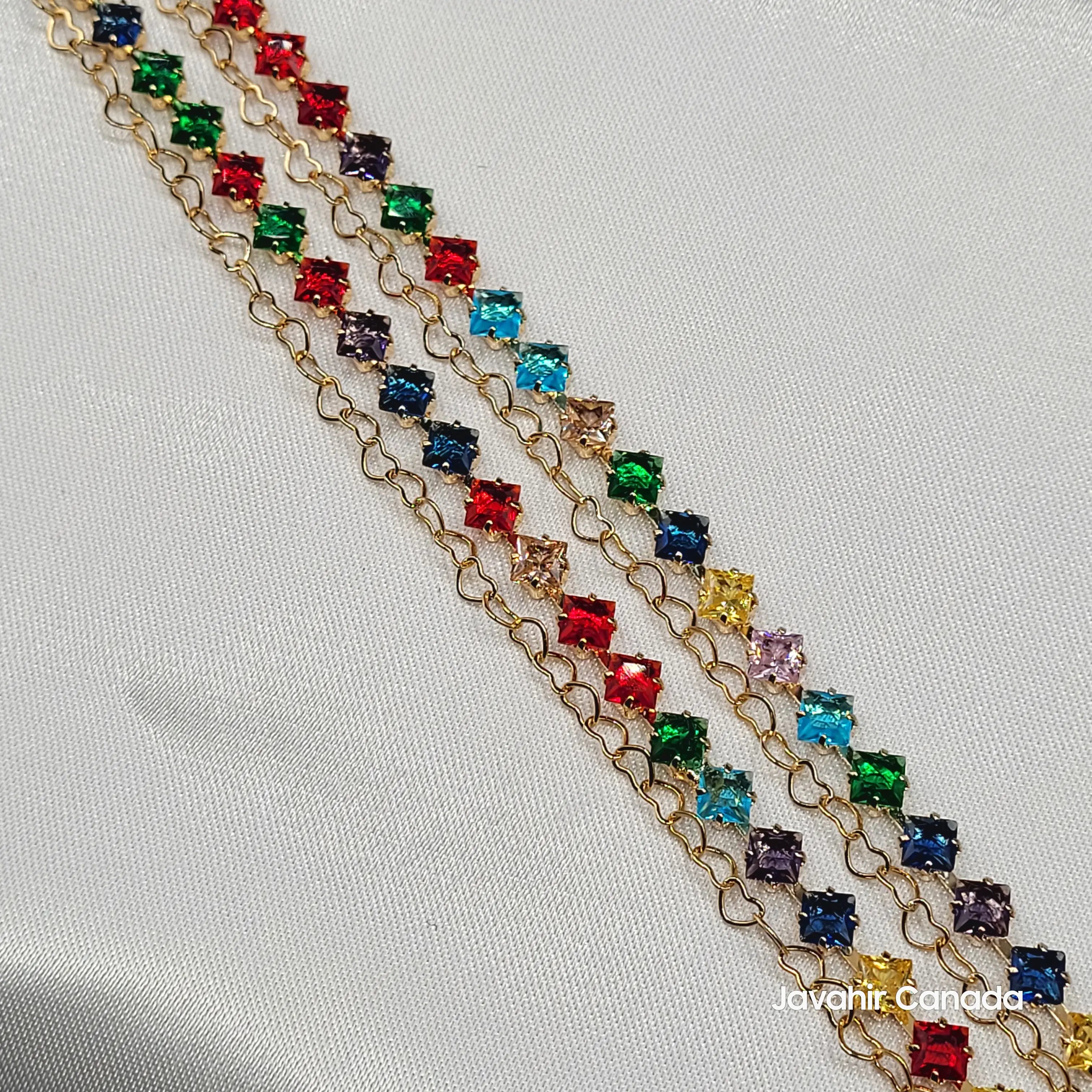 Rainbow-colored anklets with square-cut stones on gold chain