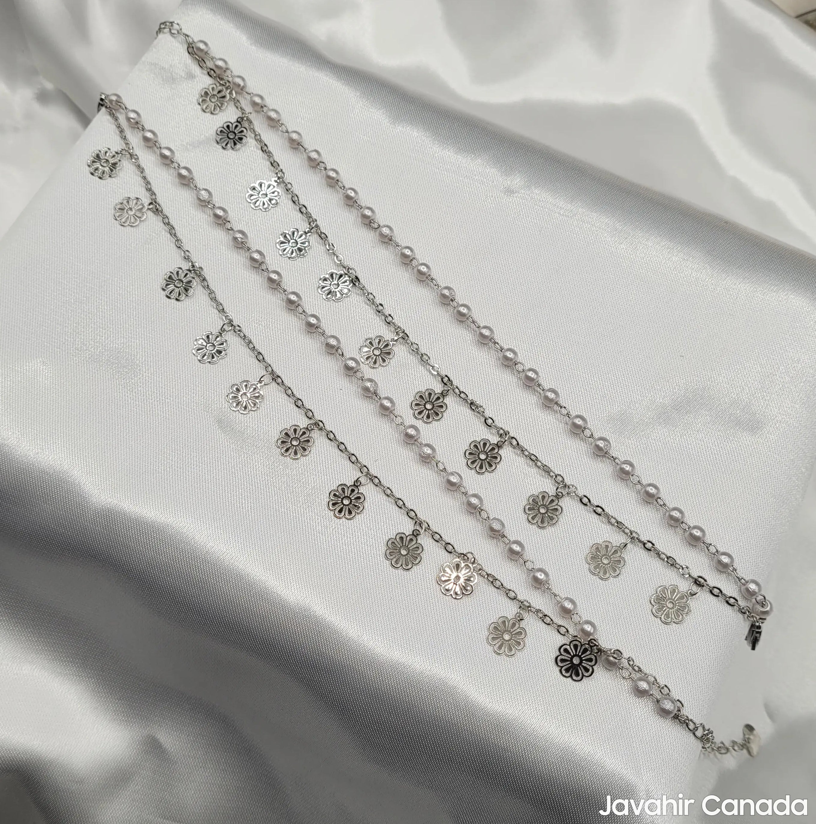 Silver tone anklets with flower pendants and faux pearls