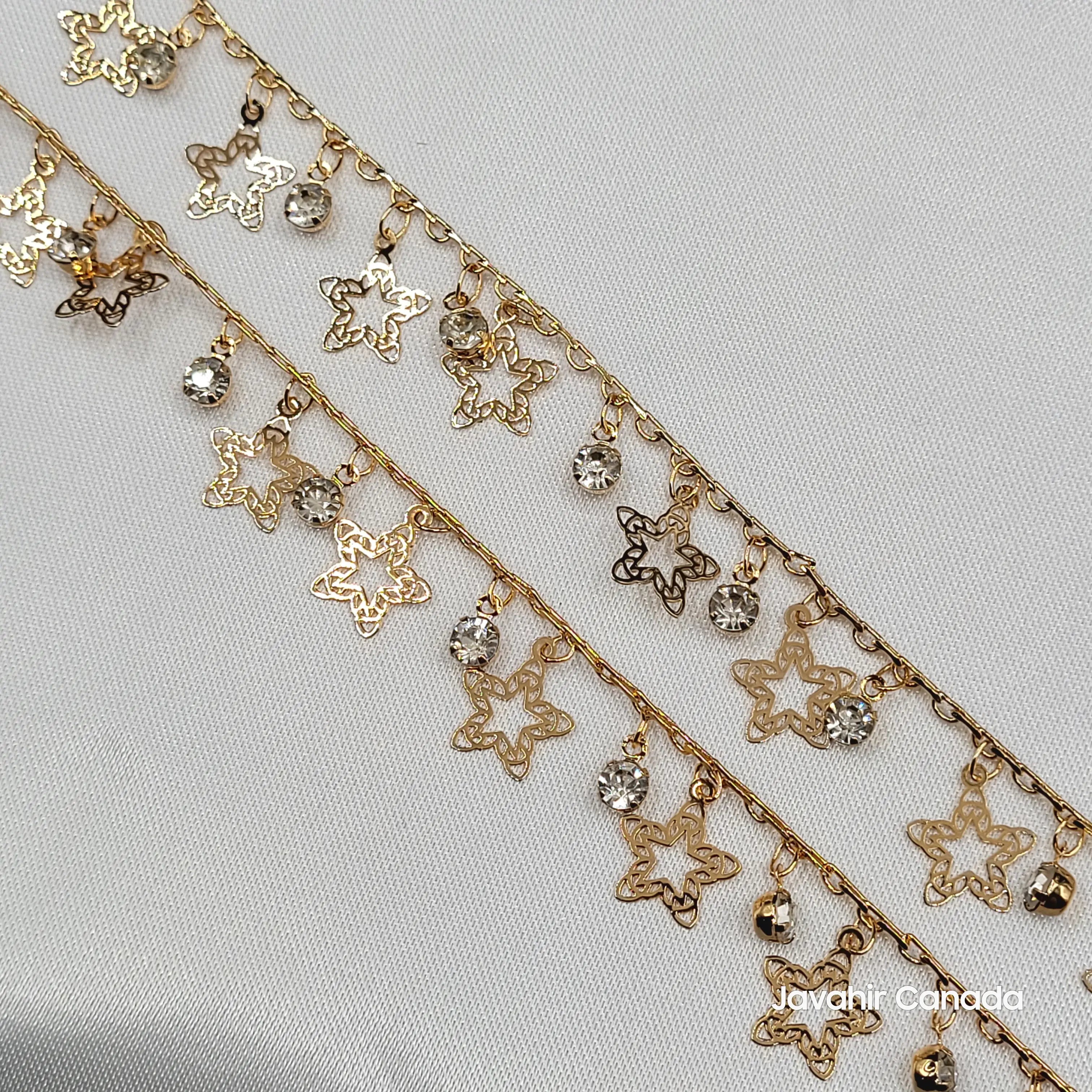 Close-up of JV5011 anklets showing intricate star-shaped charms and sparkling crystal beads