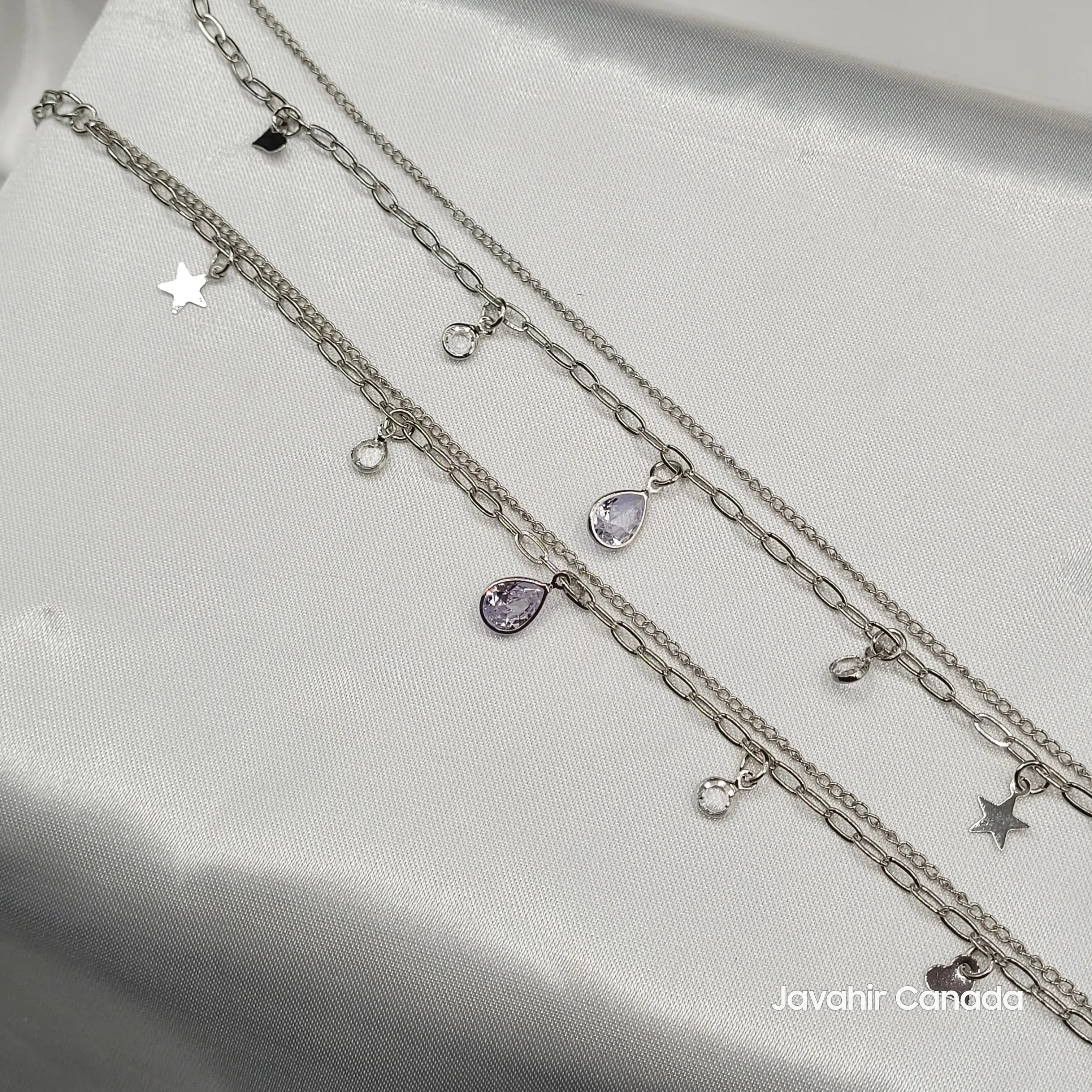 Close-up of JV5012 anklets with lavender teardrop crystals and silver-tone star and heart charms