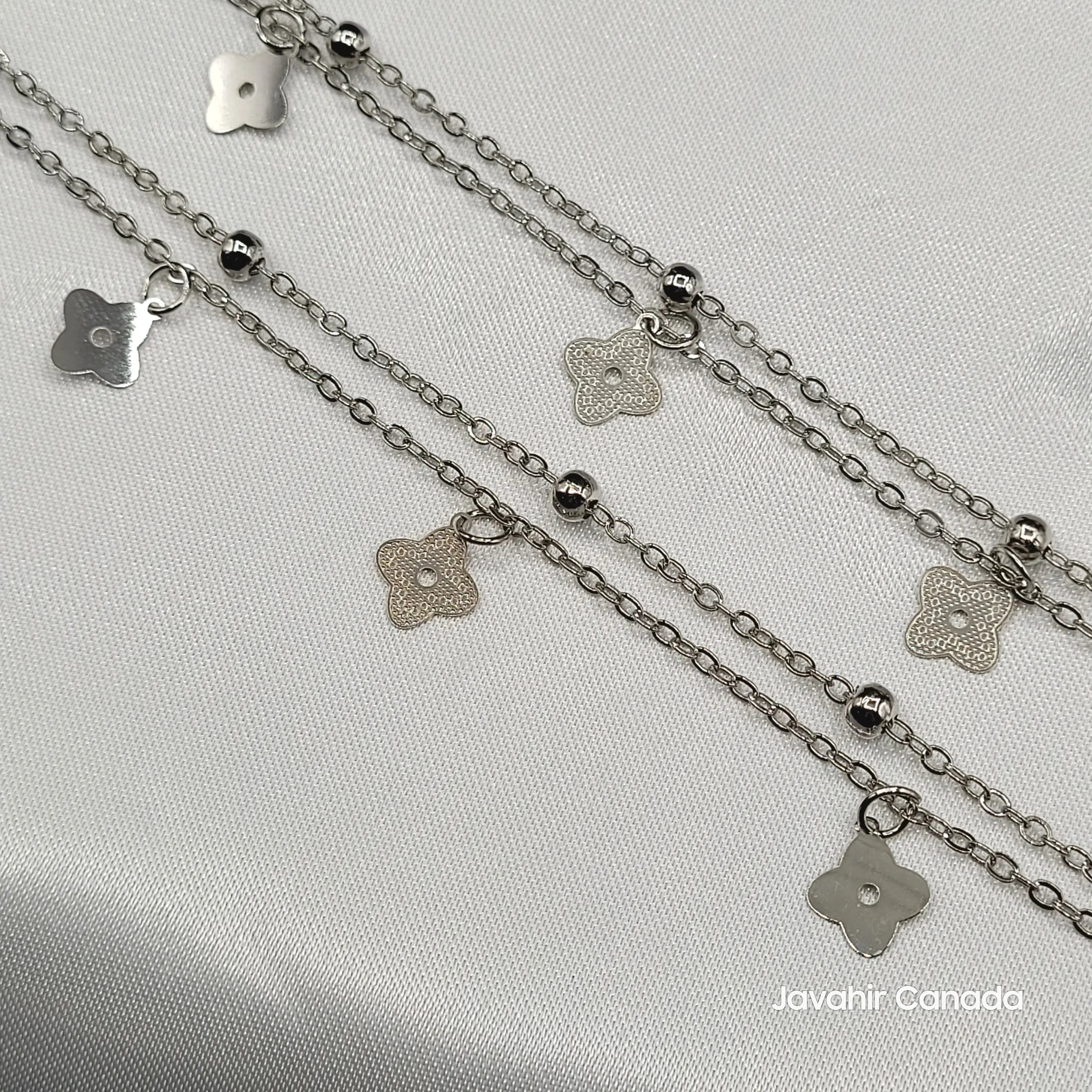 Detailed view of JV5017 silver anklets with floral drop charms and polished beads