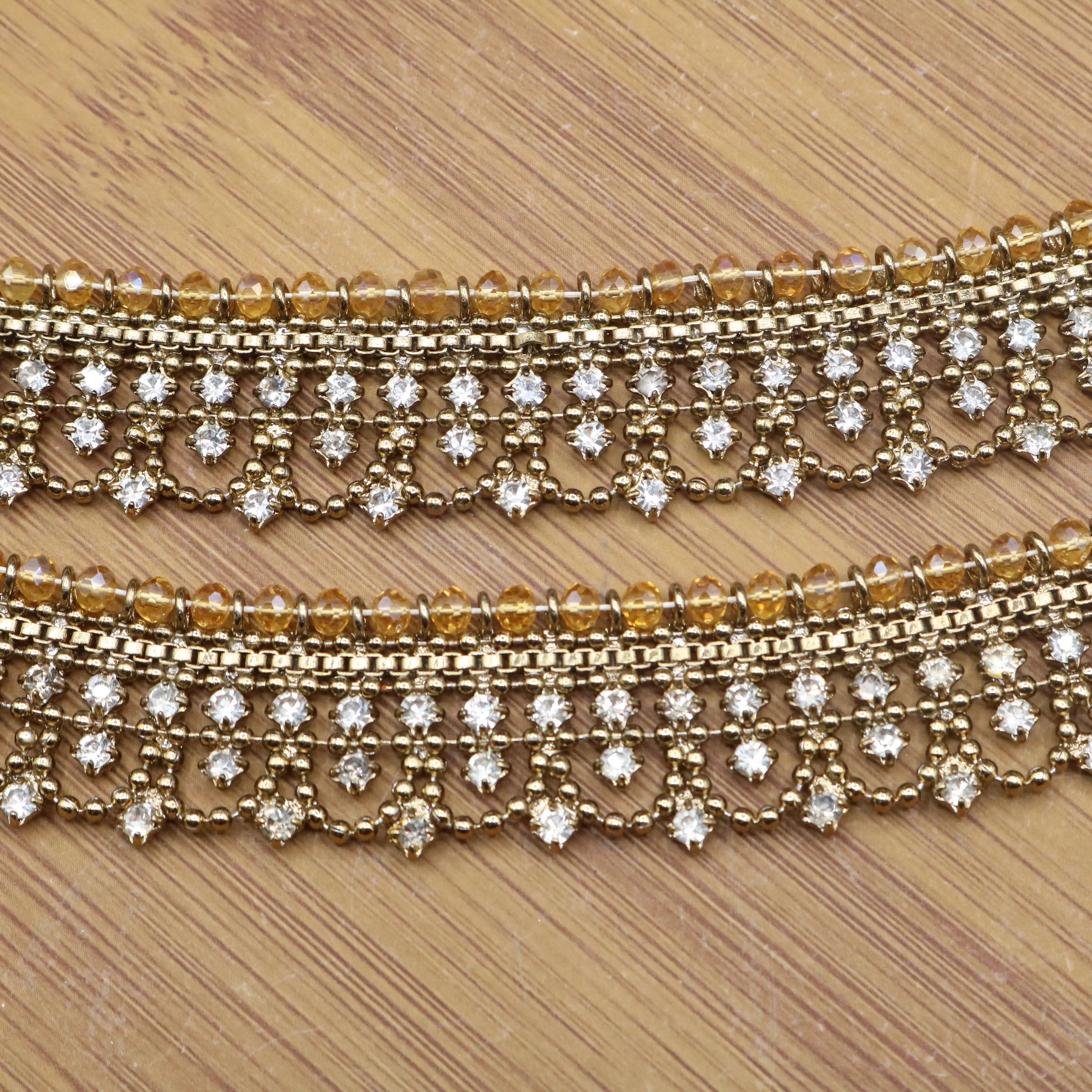 Zoomed-in image of beaded fringe and crystal detailing on gold anklet – JV5024