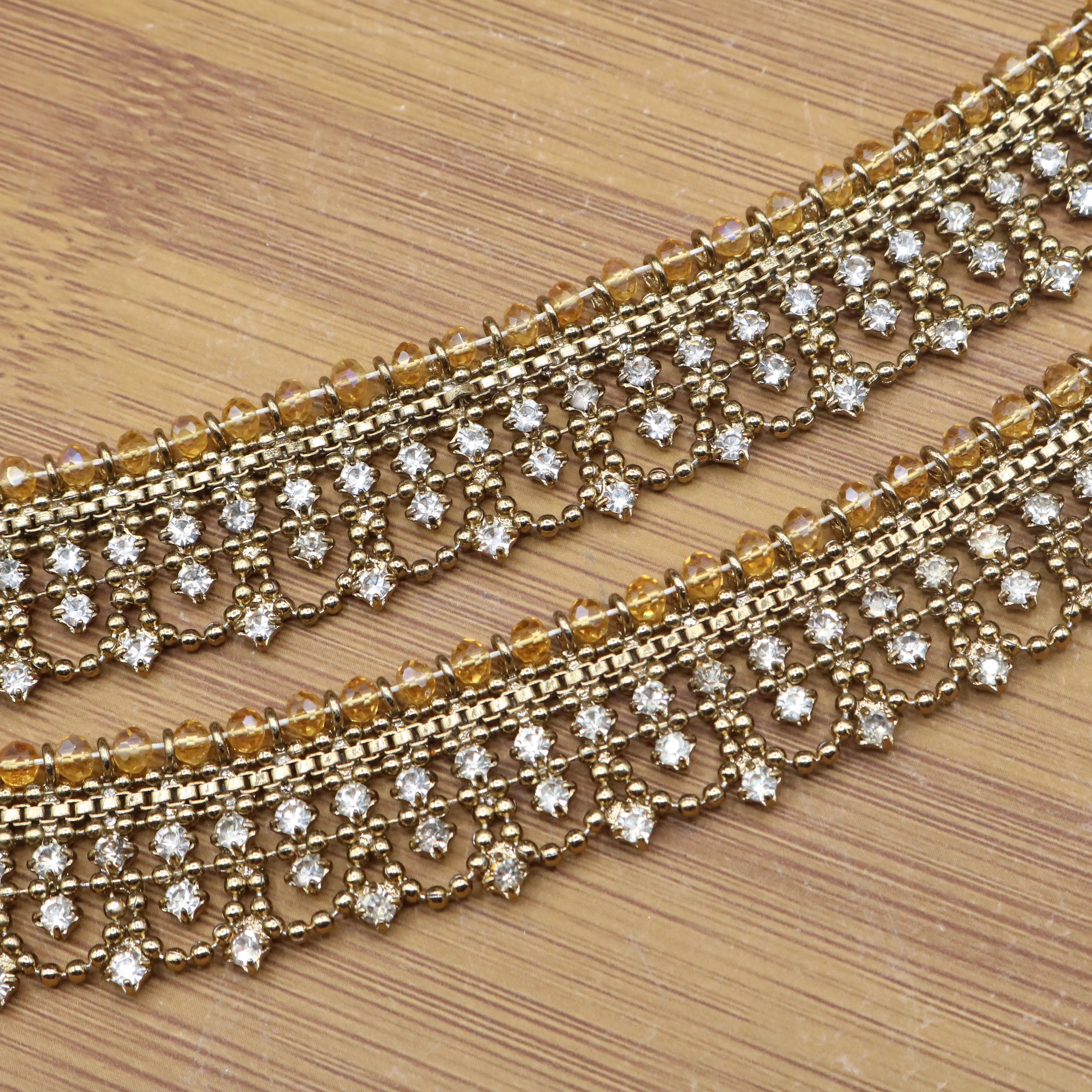 Paired gold anklets with symmetrical crystal embellishments and antique finish – JV5024