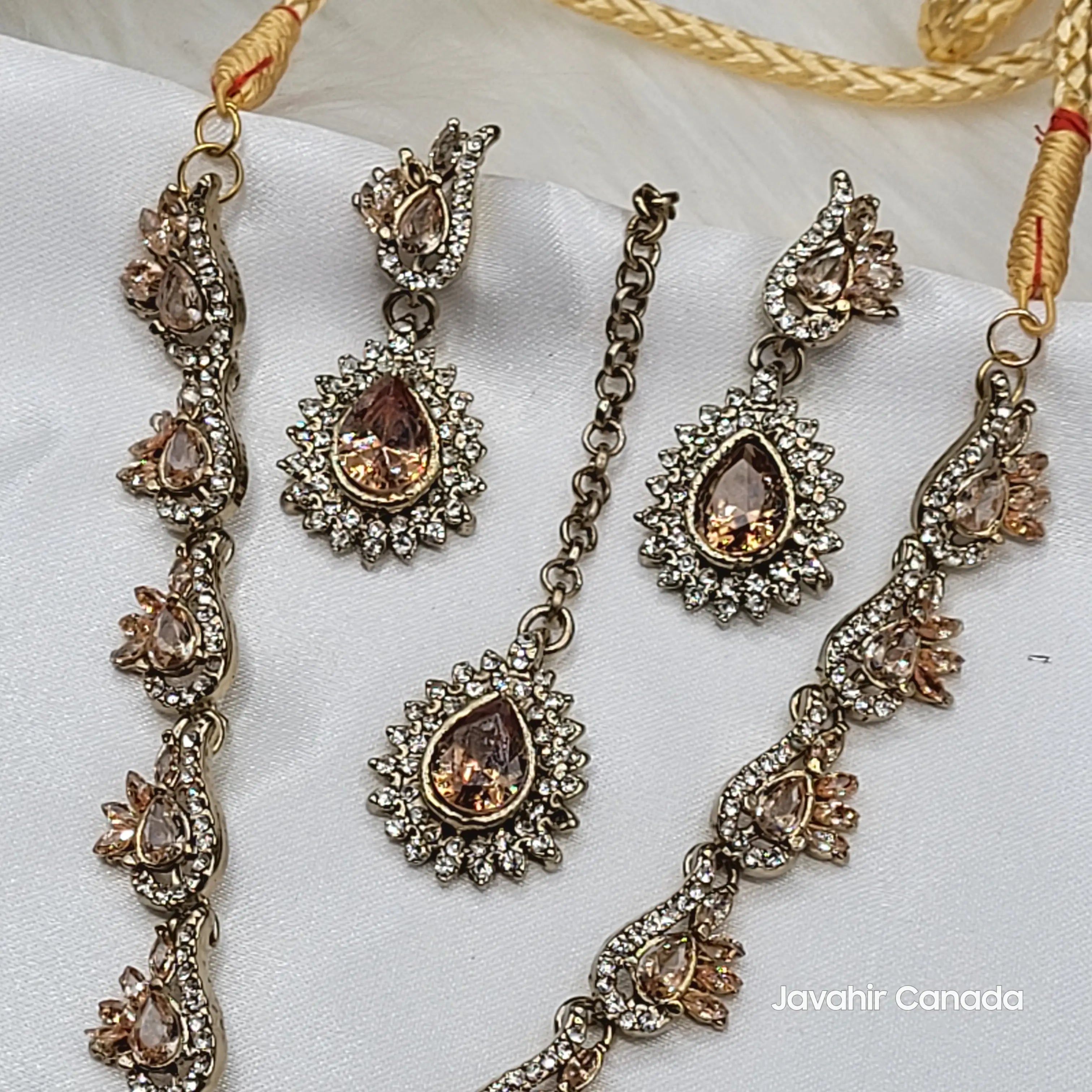 Ornate jewelry set with necklace and earrings on a white background, featuring 'Javahir Canada' branding.