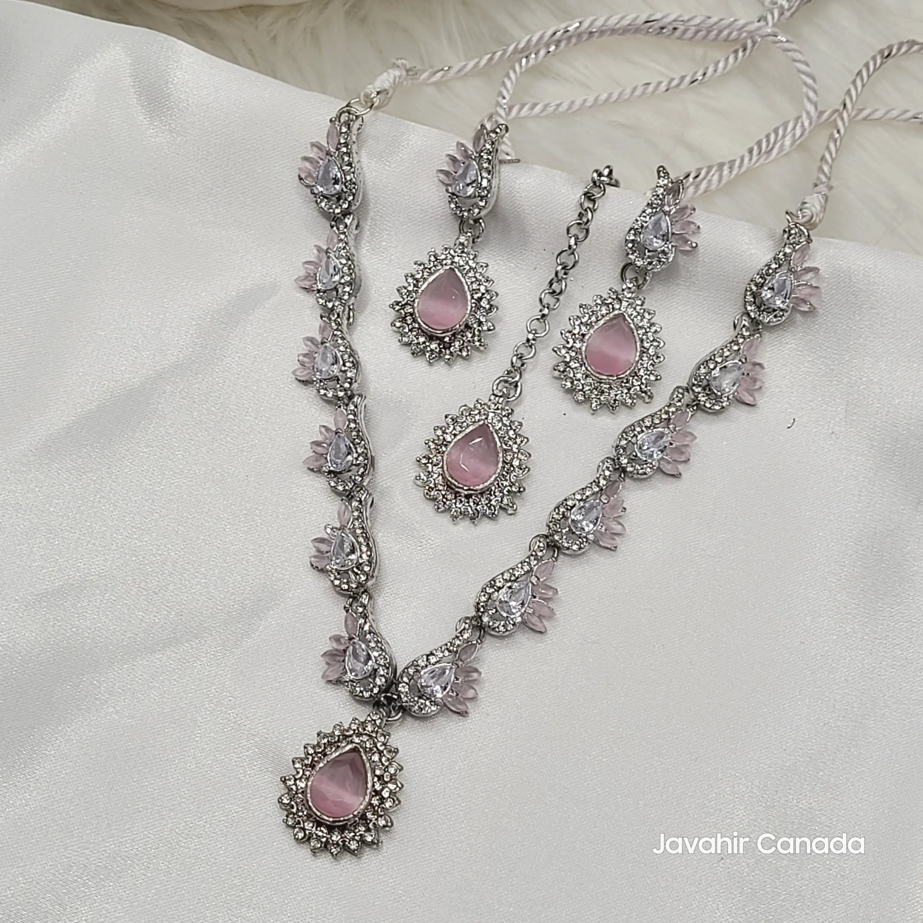JV142 rose pink floral teardrop necklace set with matching earrings on white satin background