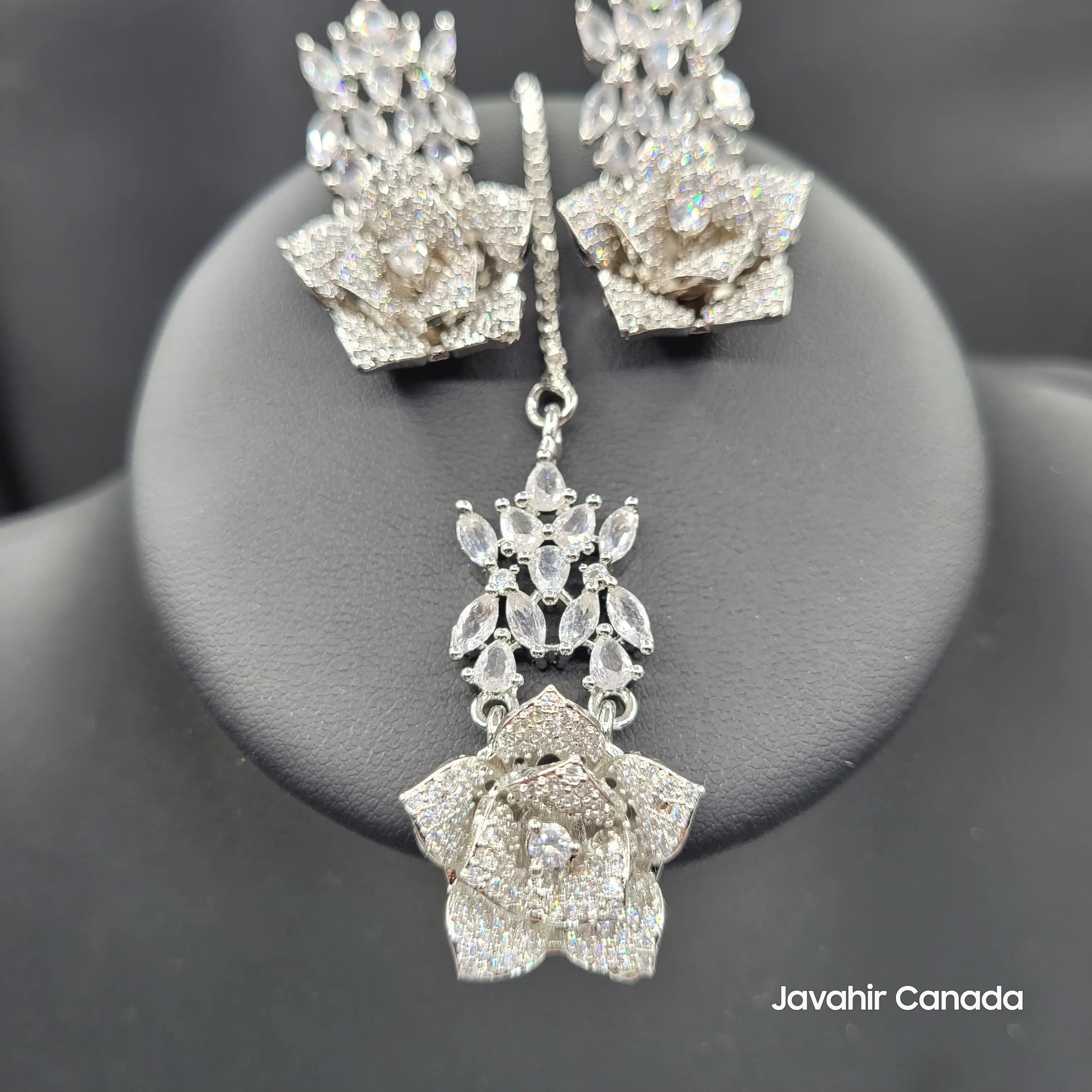 JV144 teeka featuring 3D rose-shaped elements and American diamonds on a silver-tone base.