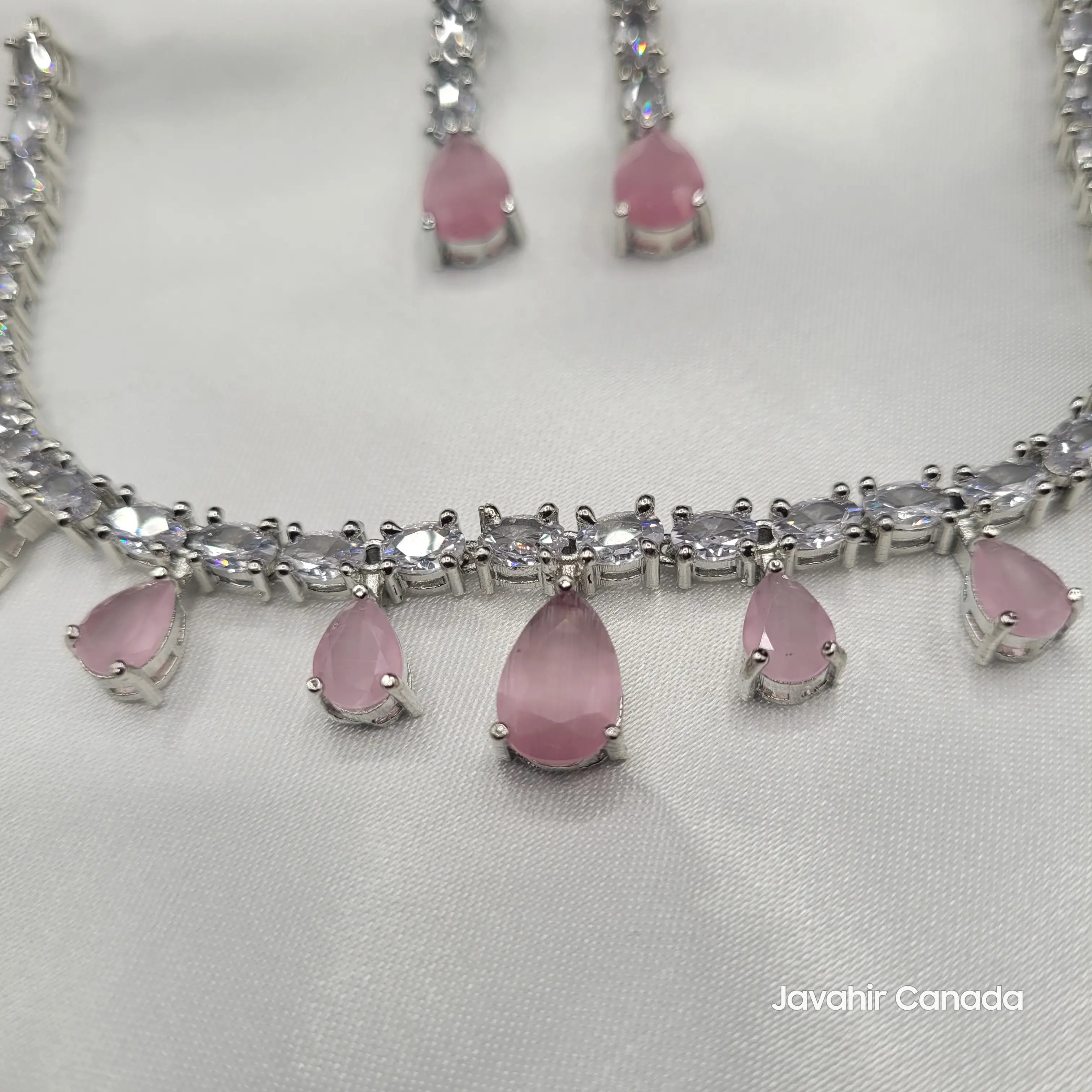 Detail view of JV145 rose pink necklace showing drop-shaped amethyst CZ stones.