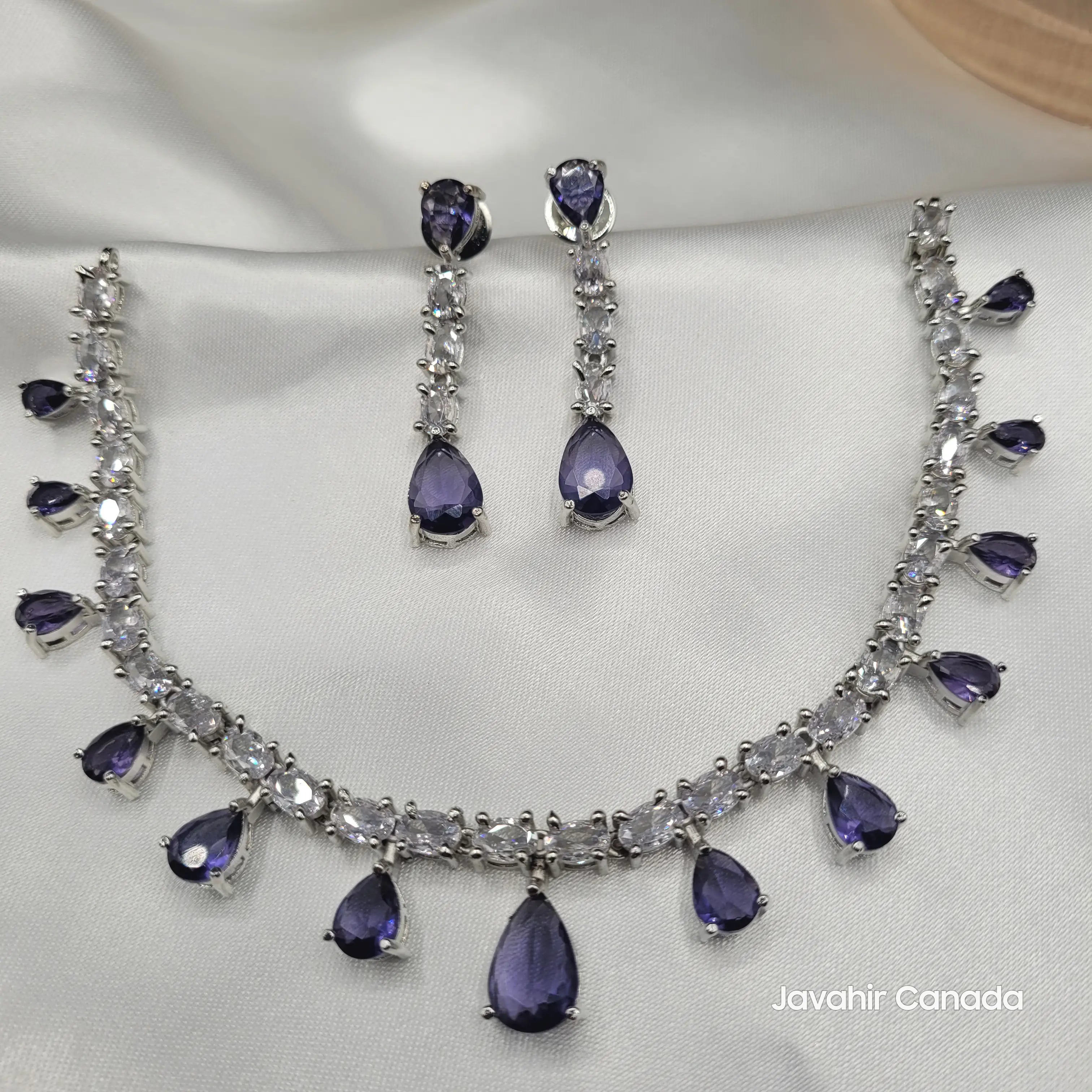 Full JV145 lavender teardrop CZ necklace and earring set displayed on satin.