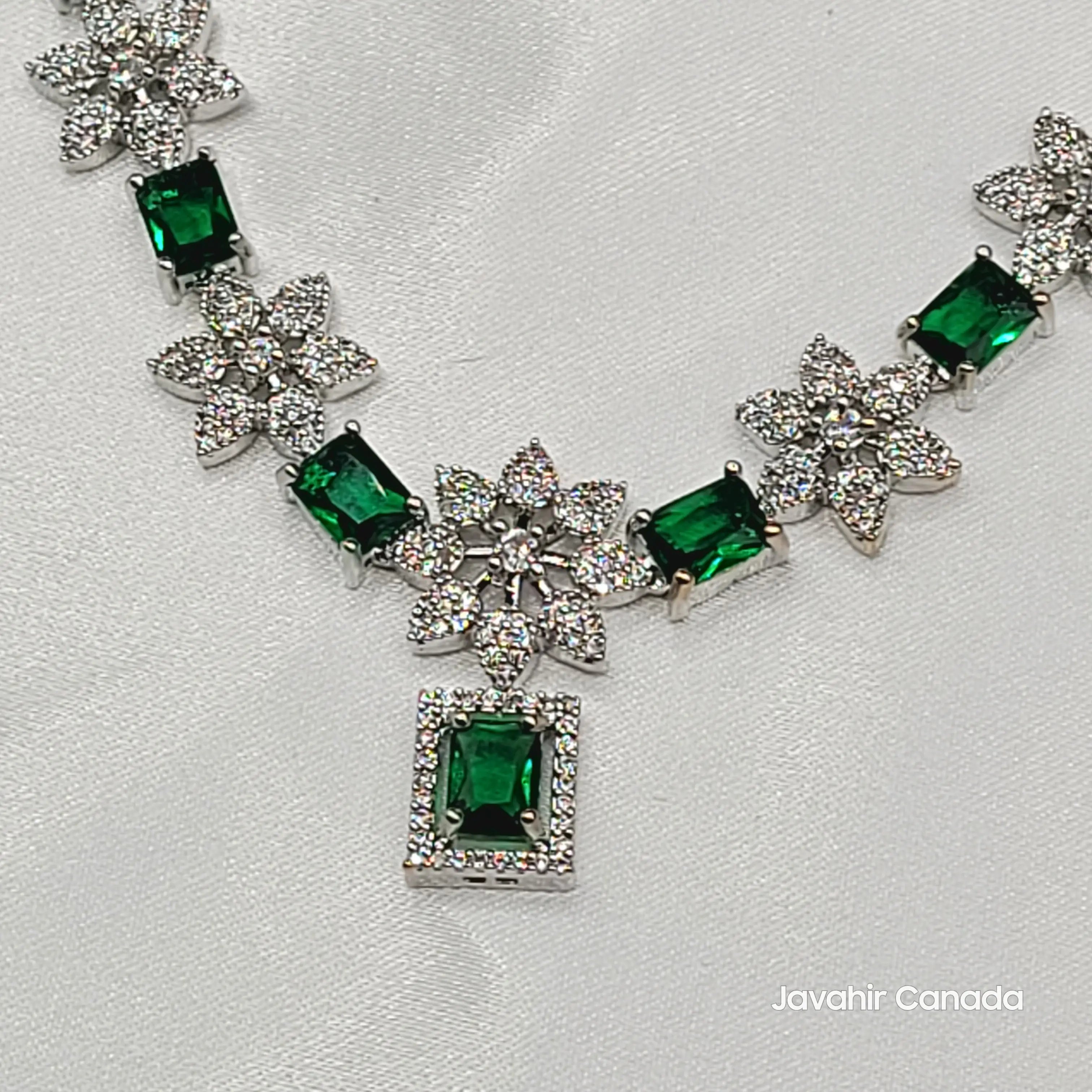 Close-up of emerald green CZ necklace with floral studded drops from JV146 set.