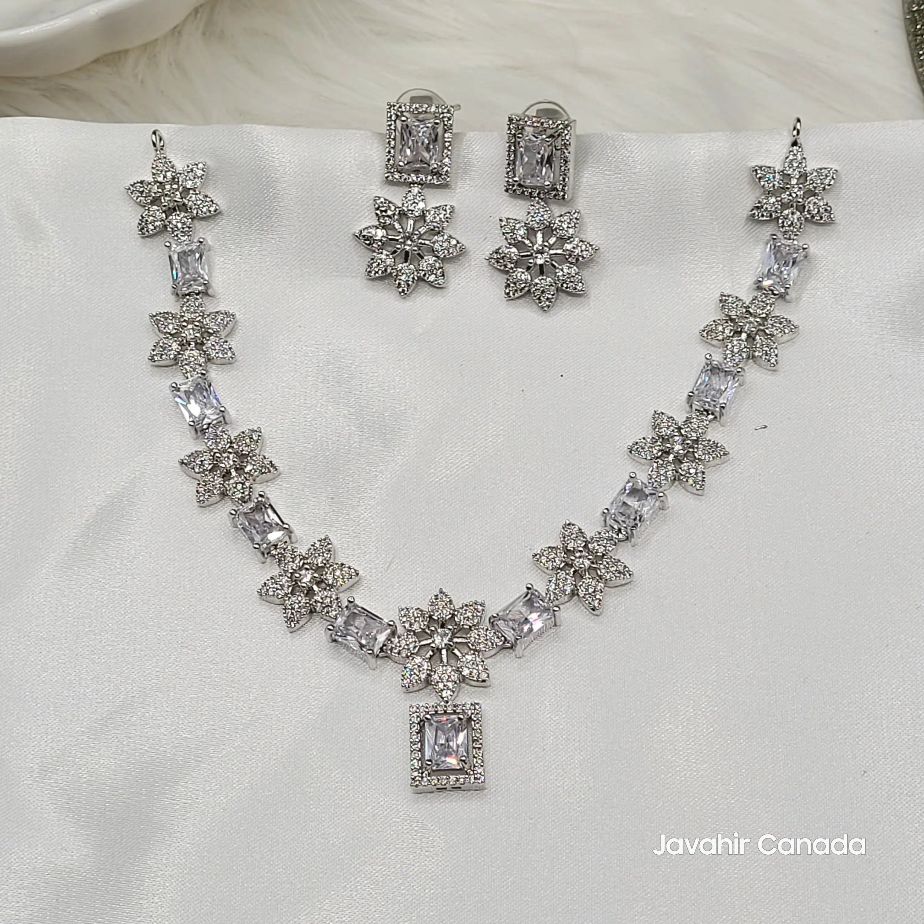 JV146 classic white CZ set on silver base with floral American diamond accents.