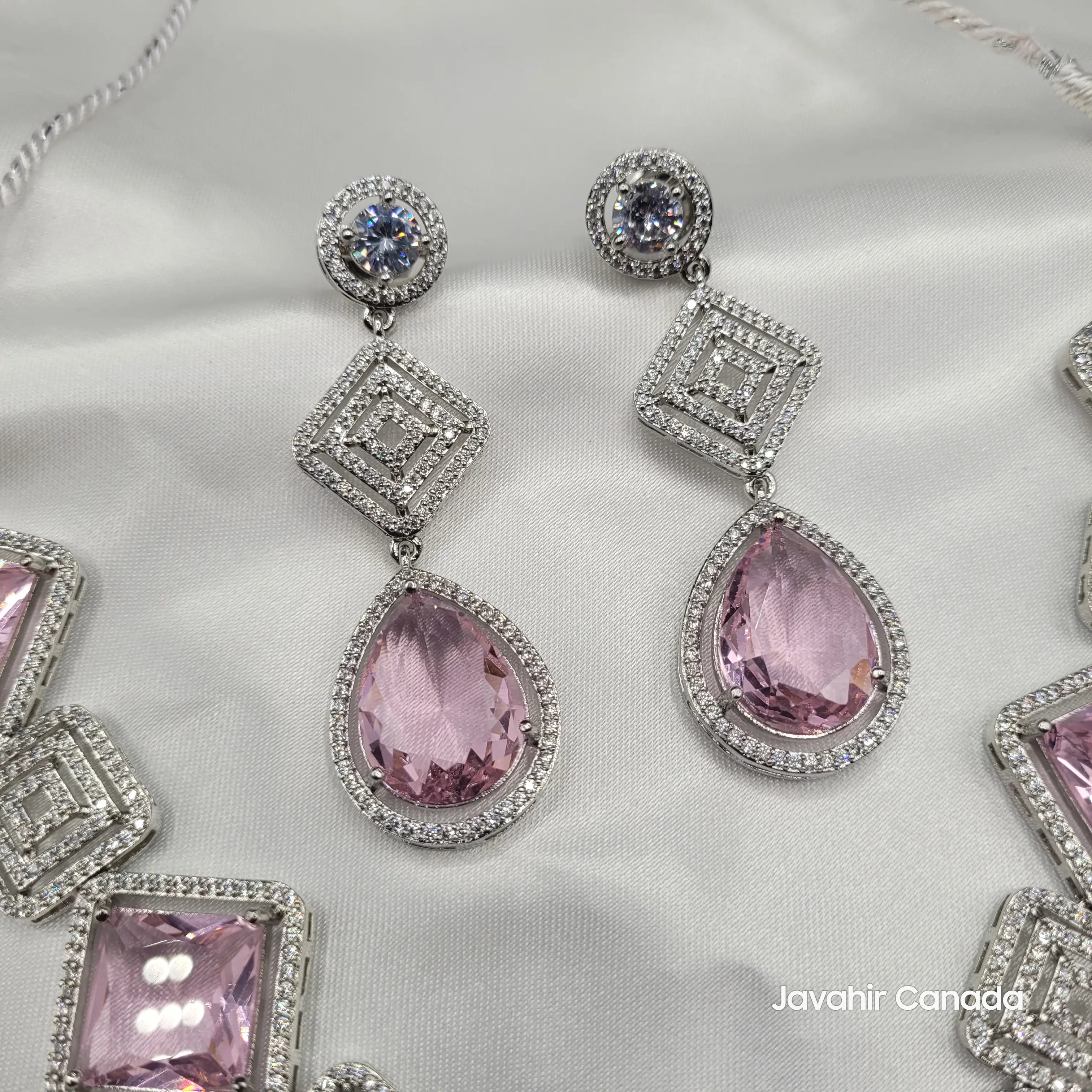 JV149 rose pink teardrop earrings with geometric square detailing on satin background.