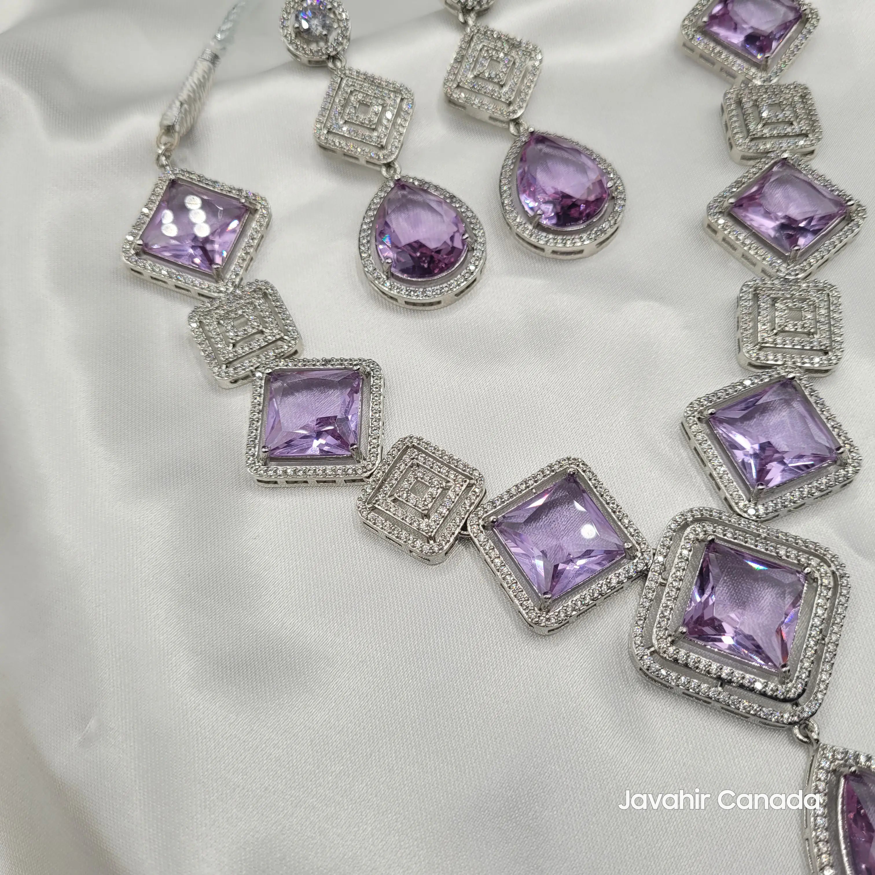 Angled view of JV149 lilac square and teardrop gemstone necklace set.