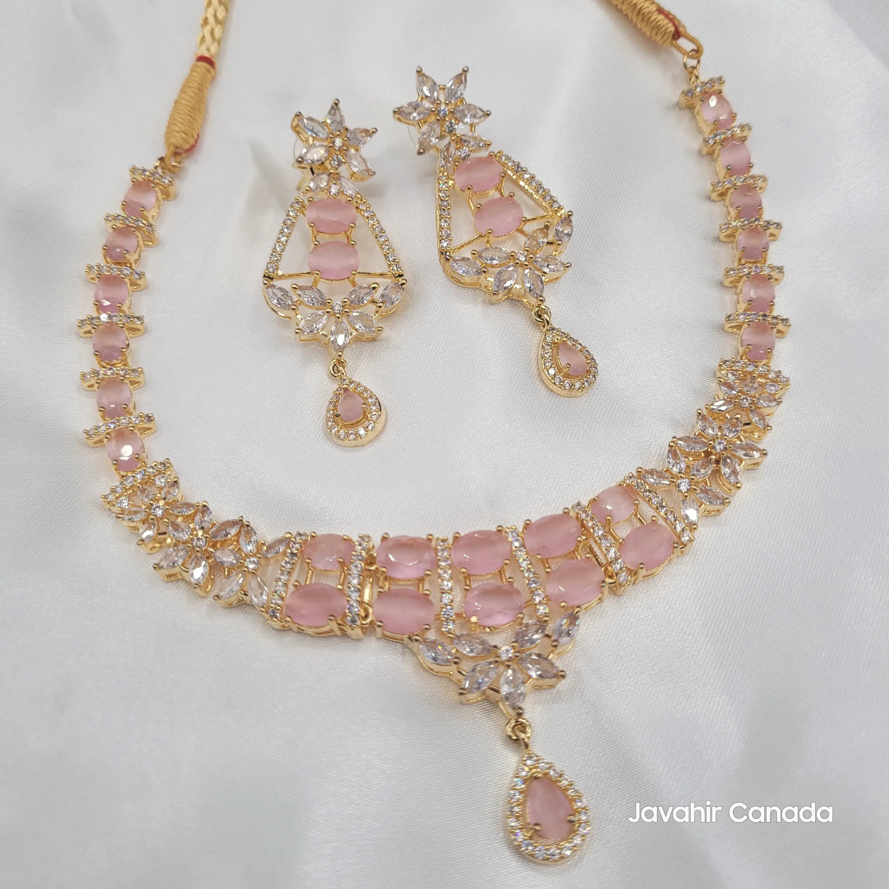 JV150 gold  necklace set with pink CZ stones, floral pattern, and teardrop pendant earrings.