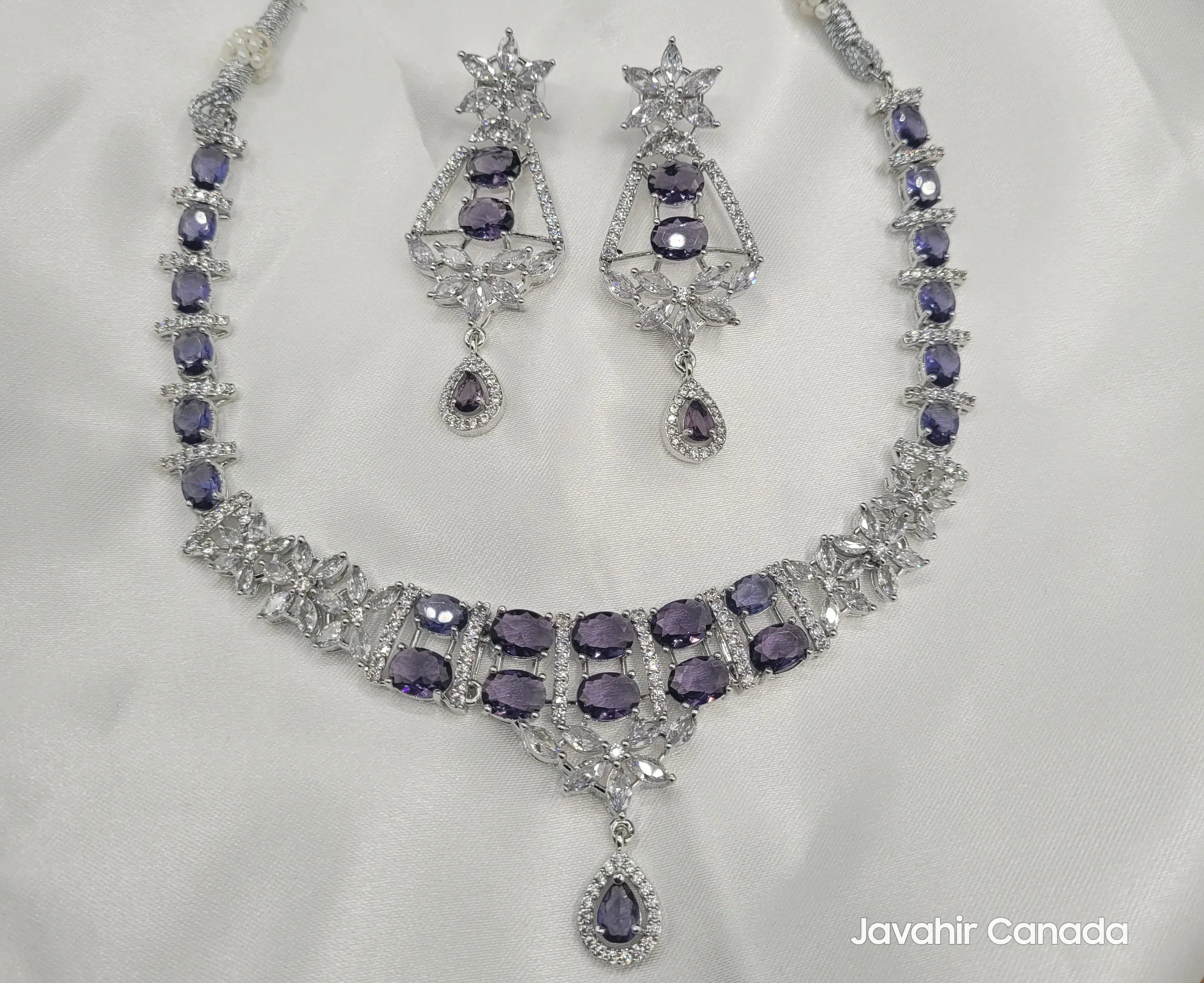 Full JV150 necklace set in silver with purple stones and floral detailing on white background.