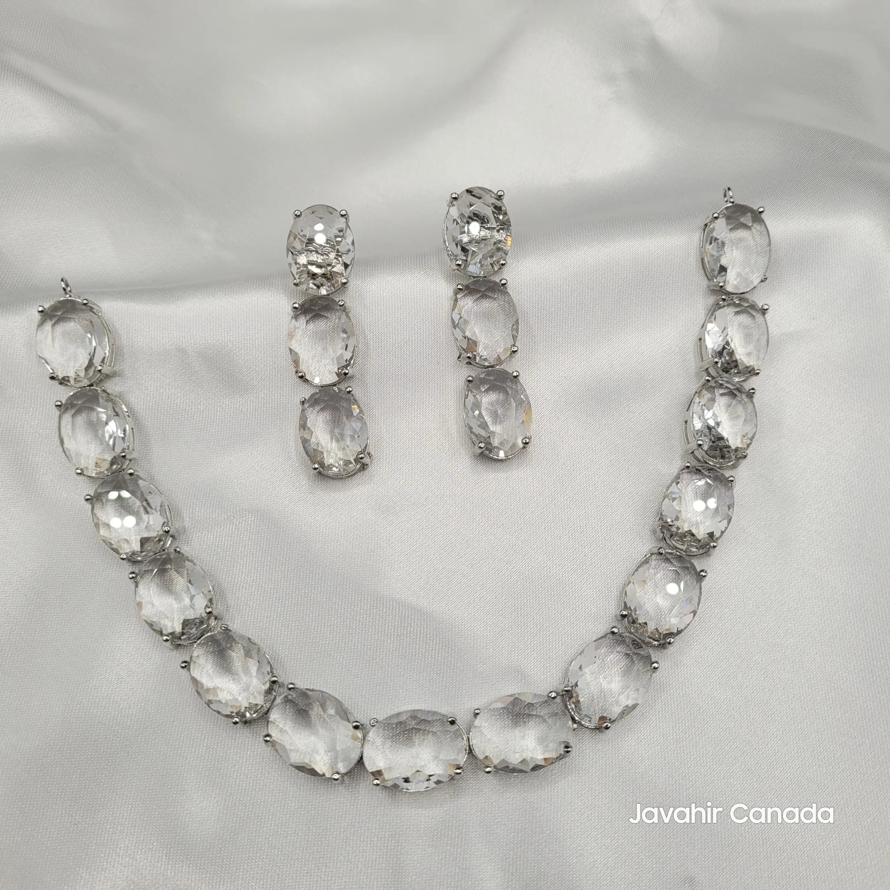 Top view of the full JV151 clear gemstone necklace and earring set