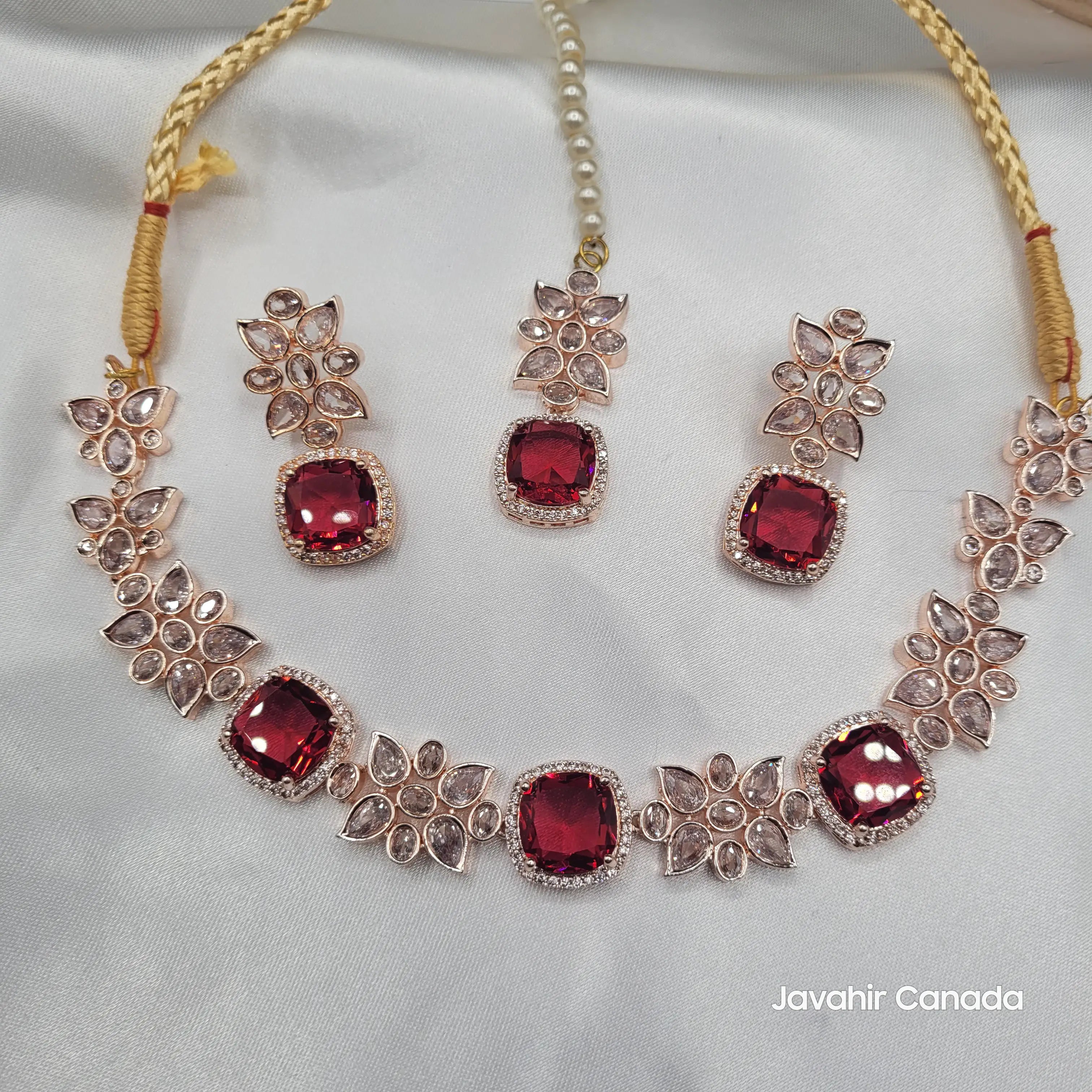 Full ruby red zircon necklace set from the JV153 collection, complete with tikka and floral motif earrings in a rose gold setting.