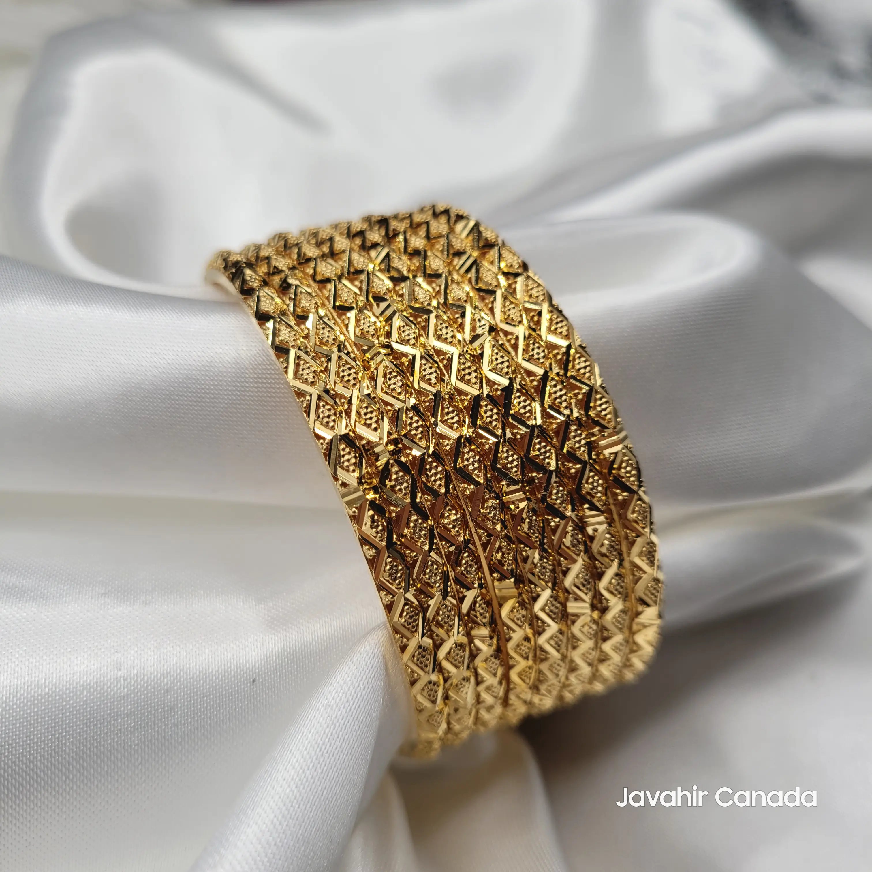 Elegant gold plated bangles with geometric design handcrafted in Pakistan