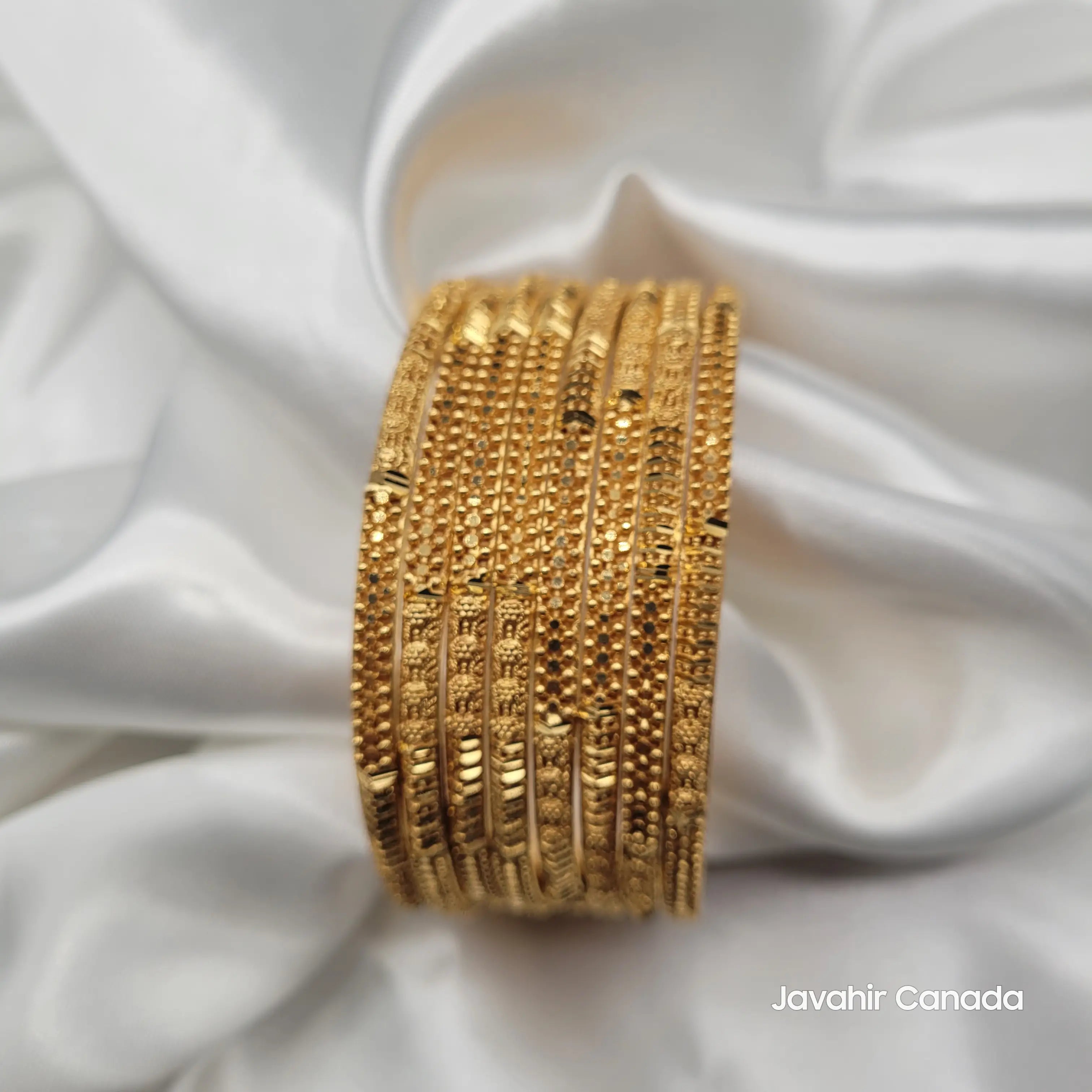 Front view of JV3032 gold bangles with mixed traditional textures