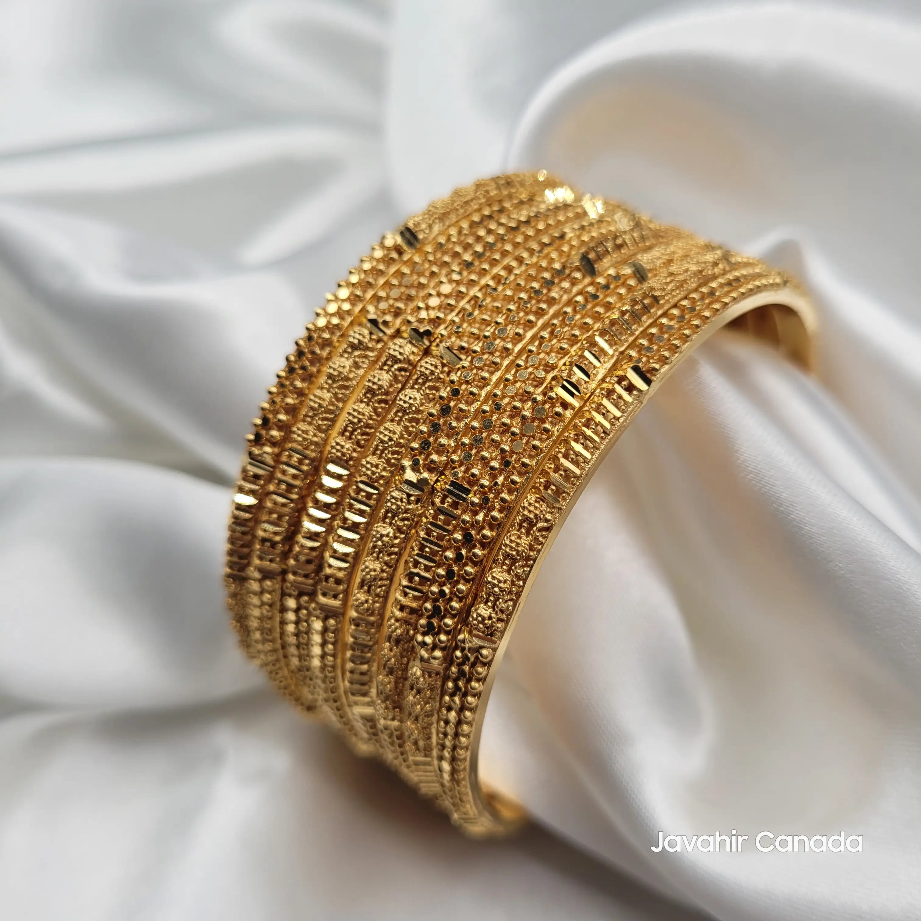 Elegant 22K gold plated bangles set with dotted and floral patterns