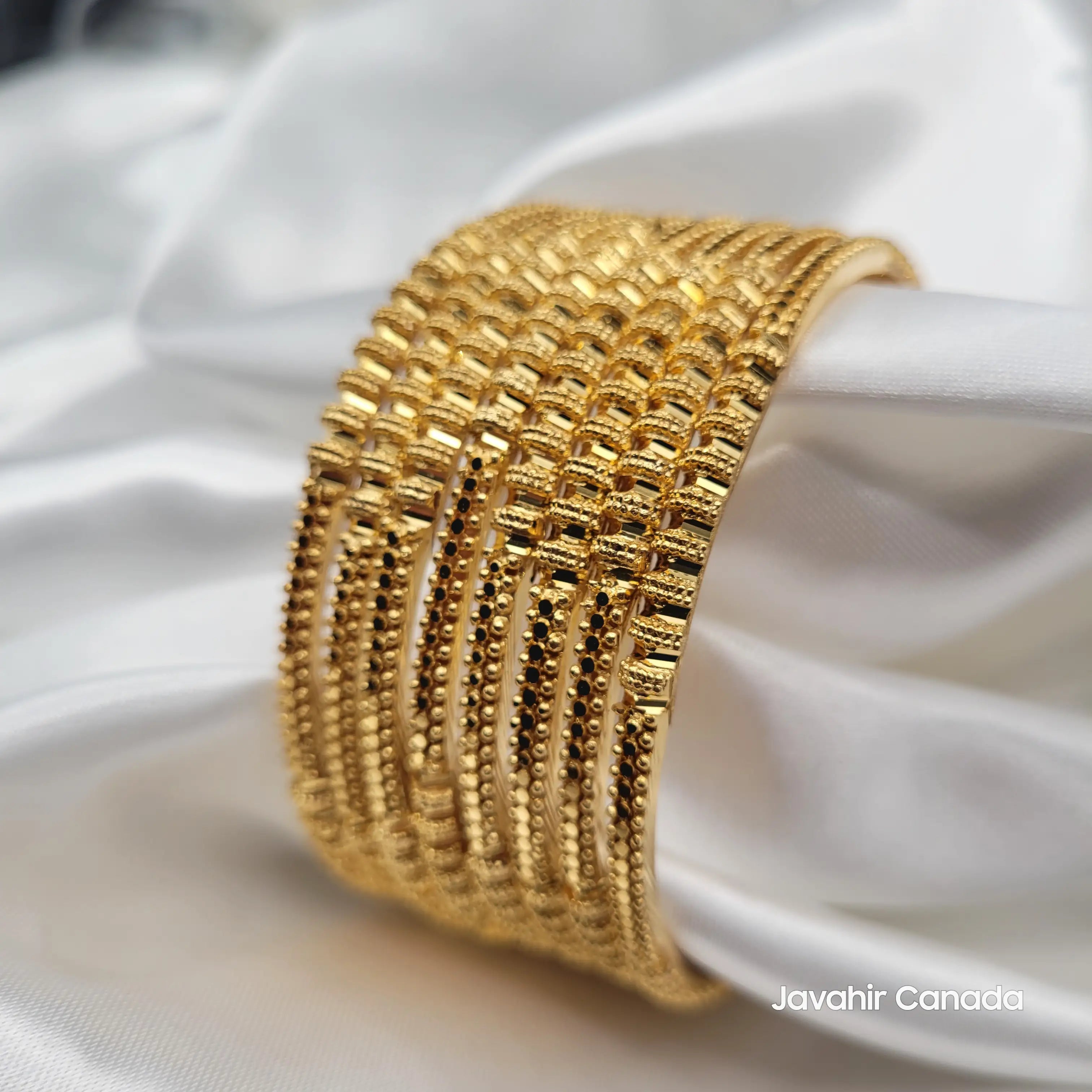 Side perspective of JV3033 bangles set showing high shine finish