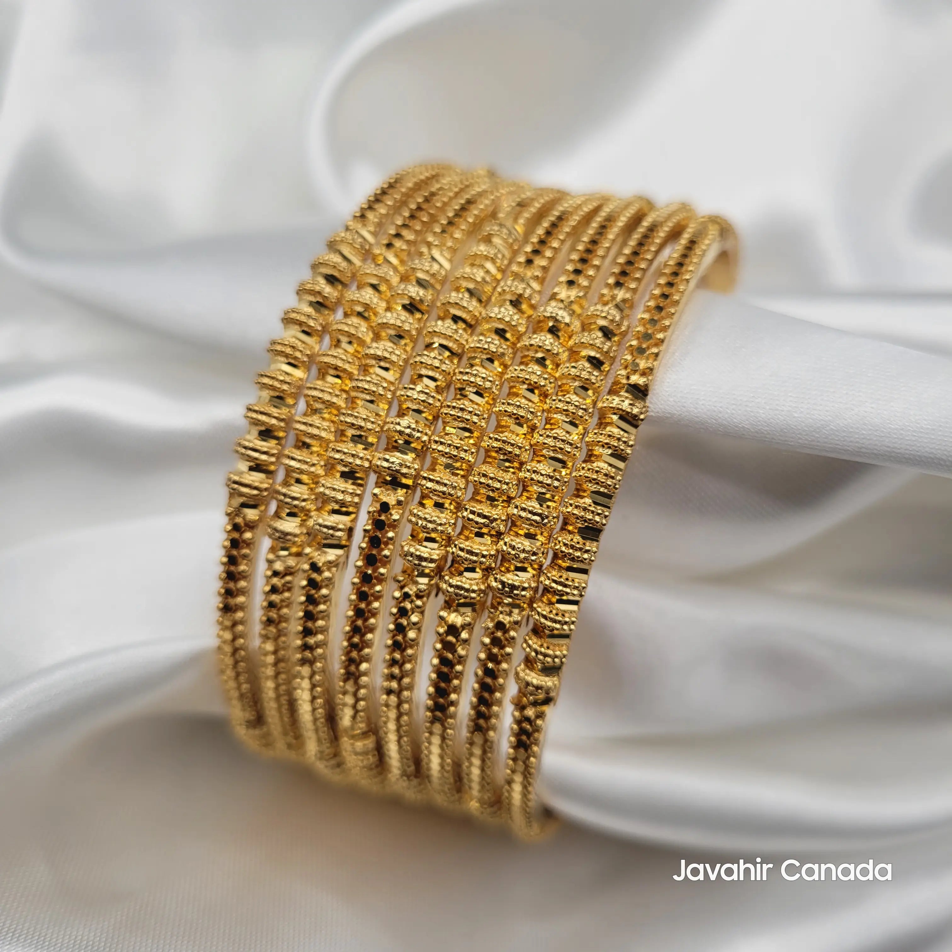 Beautifully arranged gold bangles set of 8 with modern-traditional style