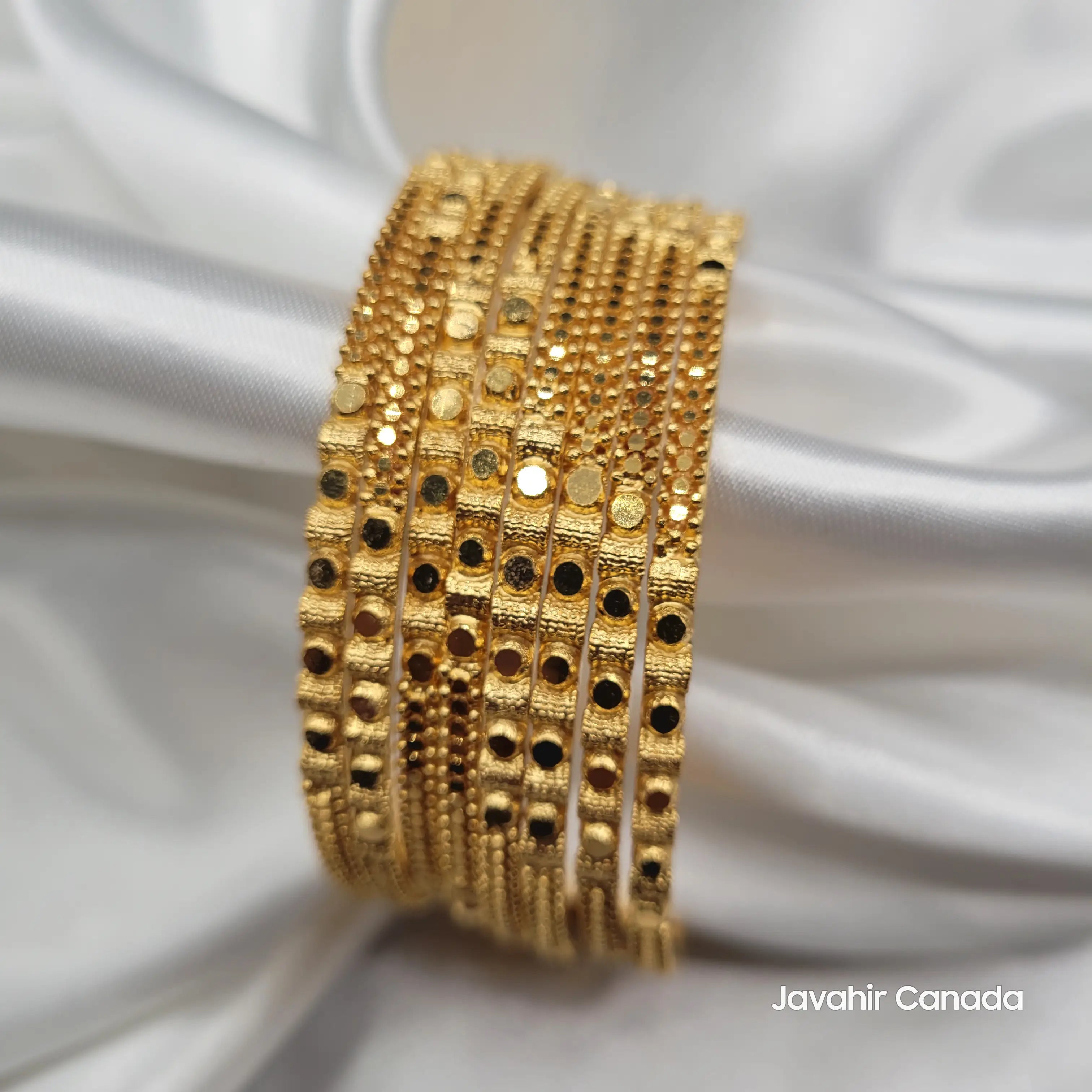 Side angle showing the gloss and craftsmanship of Pakistani gold bangles