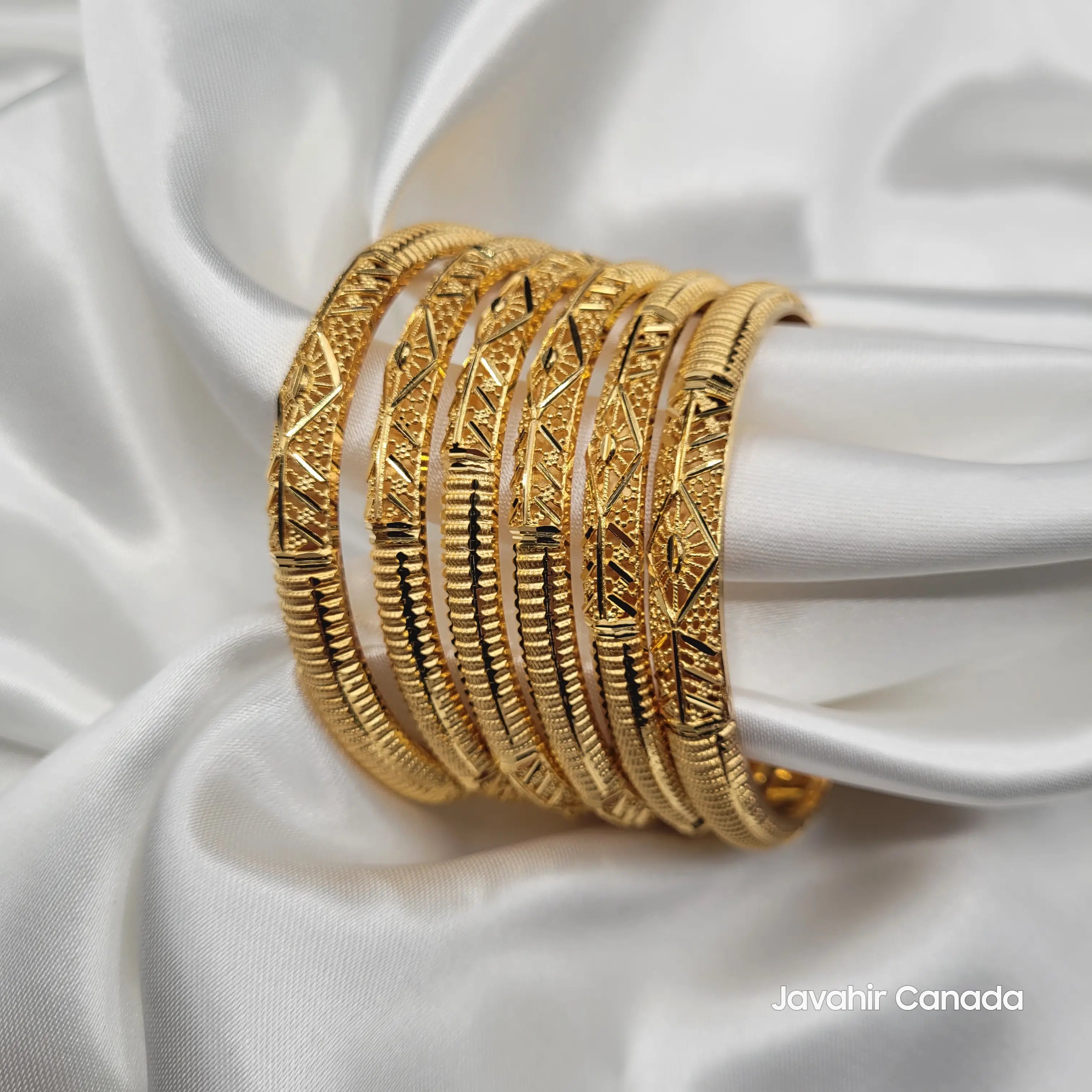 Side view of JV3036 bangles with engraved arrow and diamond shapes