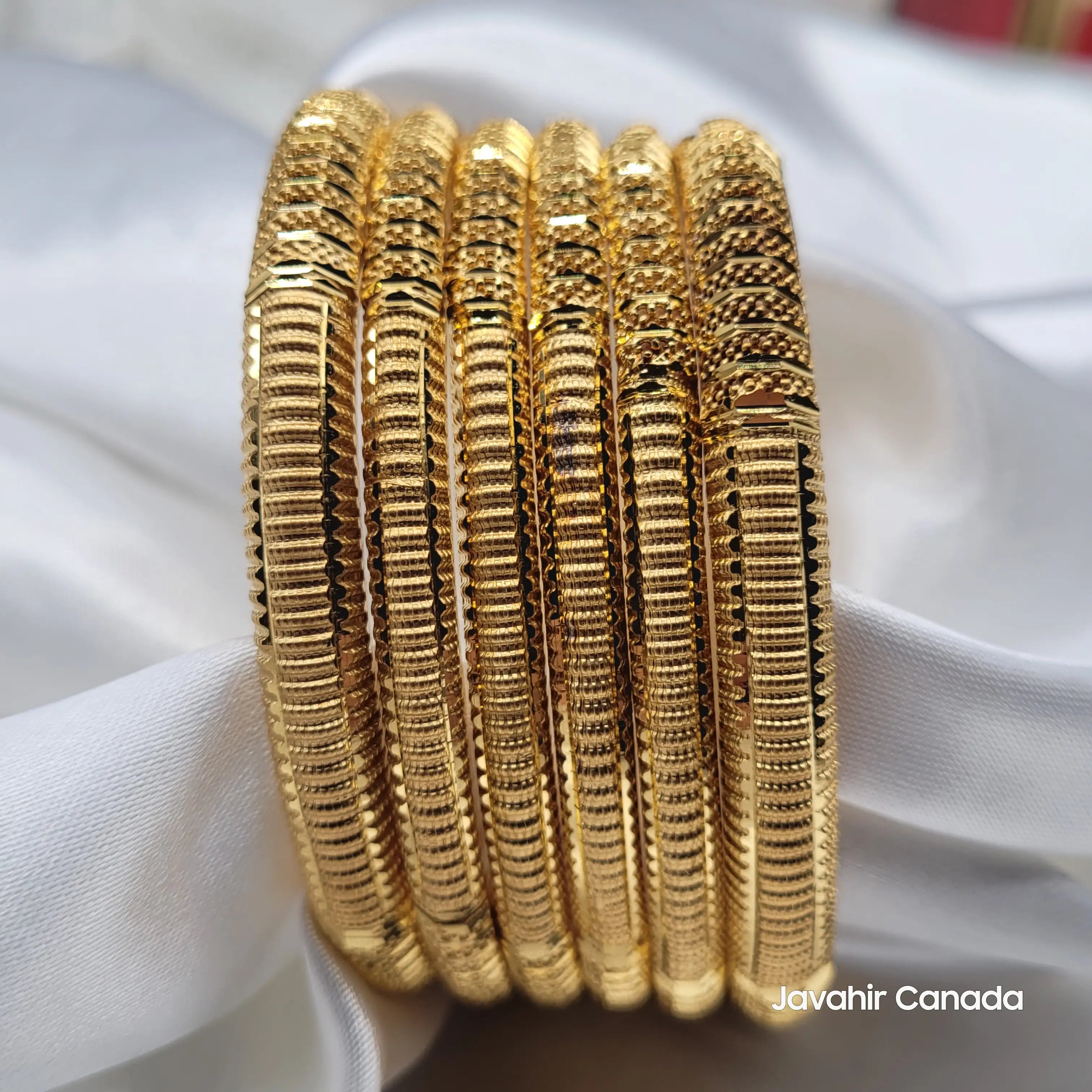 Close-up of JV3038 bangles showing lined and textured surface