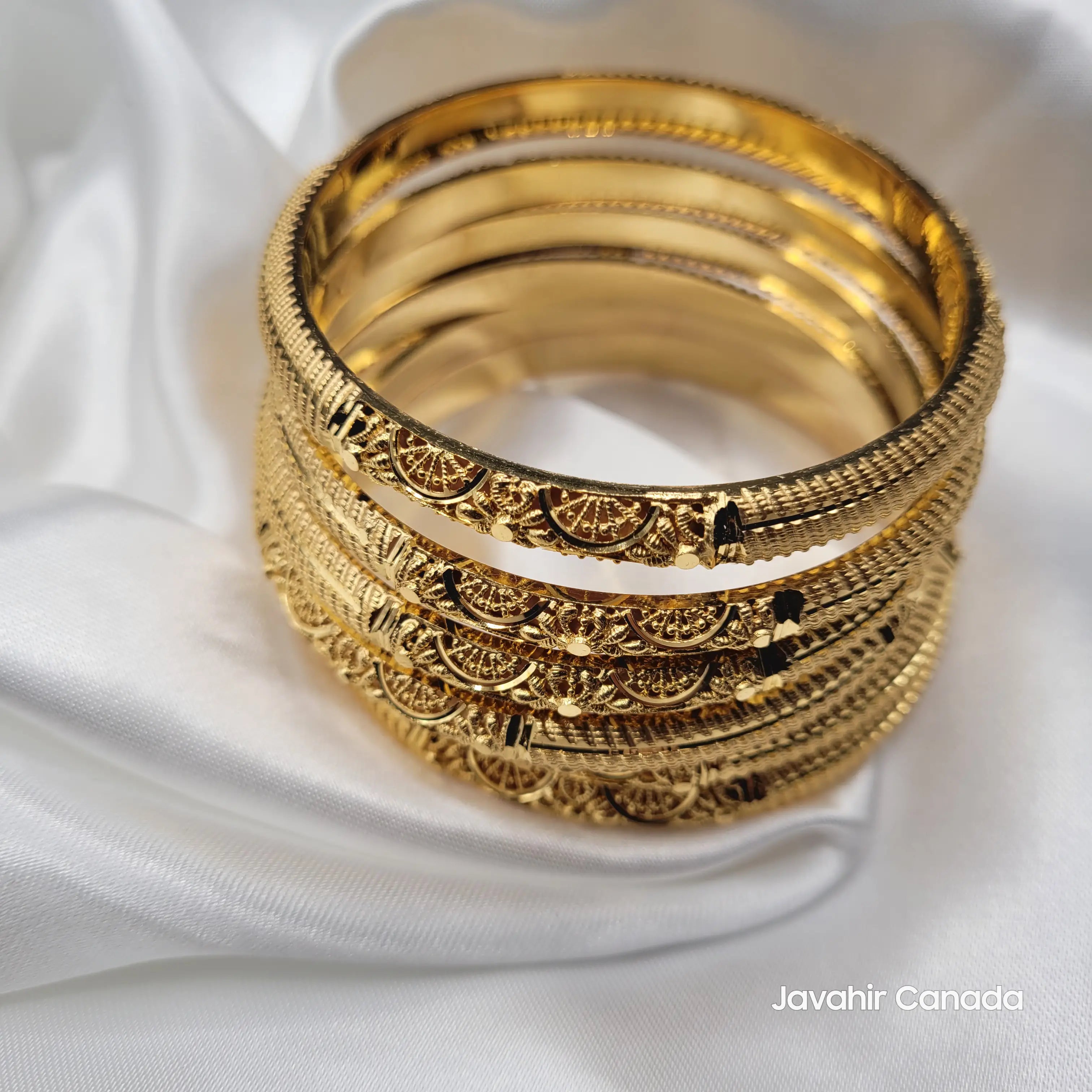 Side view of JV3039 crescent pattern bangles with intricate cutwork