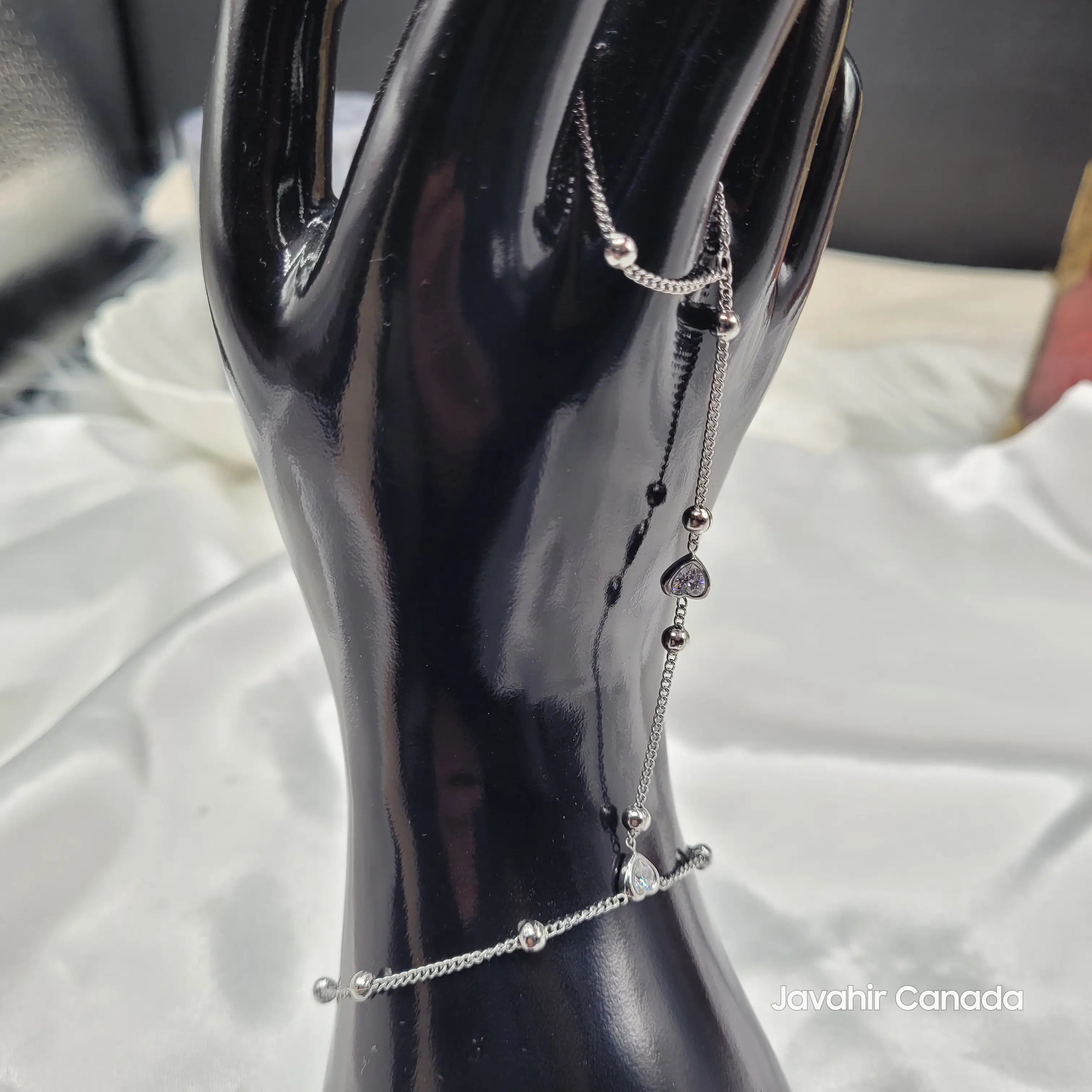 Side angle of JV4022 Haath Phool bracelet with sparkling CZ hearts and round beads