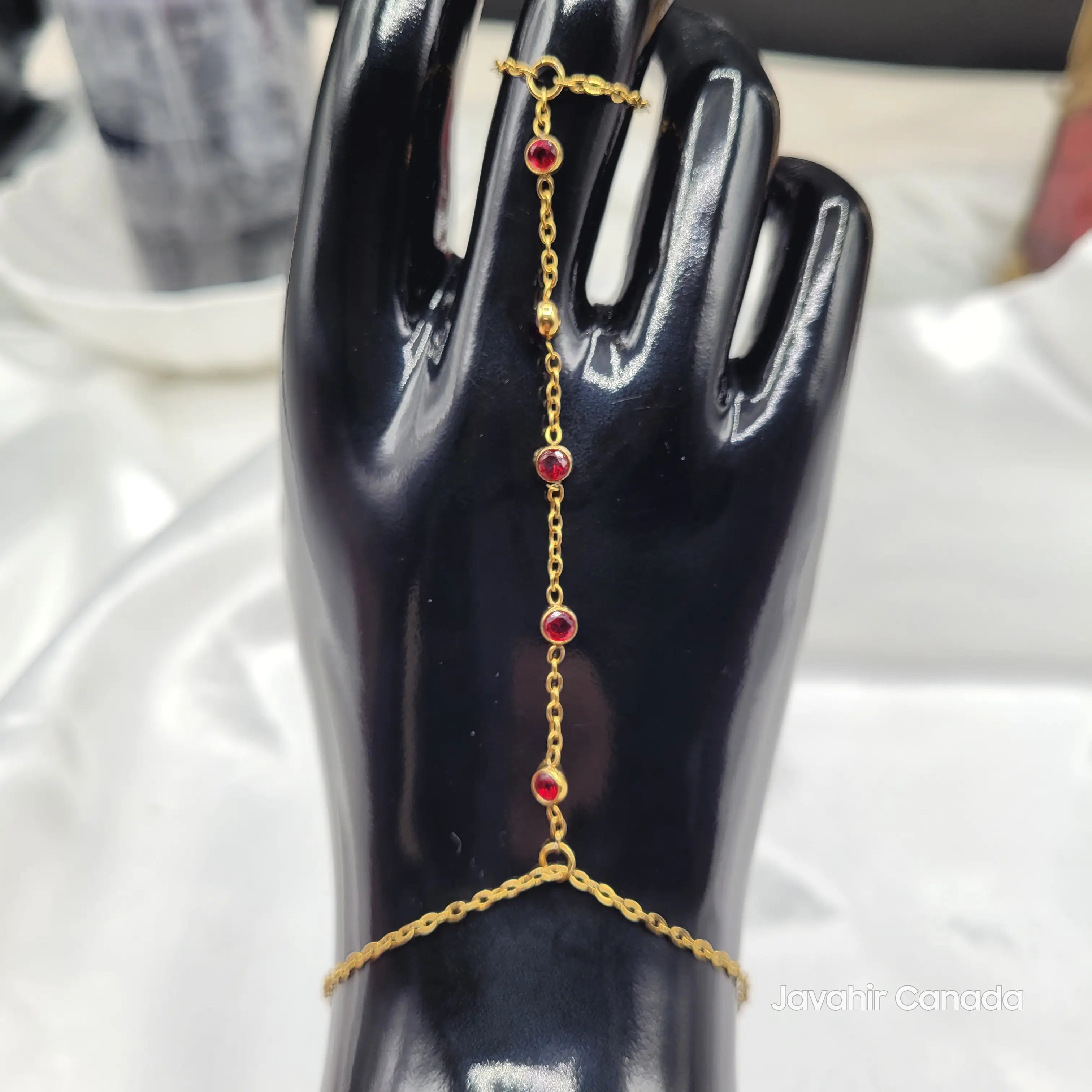 JV4024 Red Stone Hand Harness Bracelet on display stand