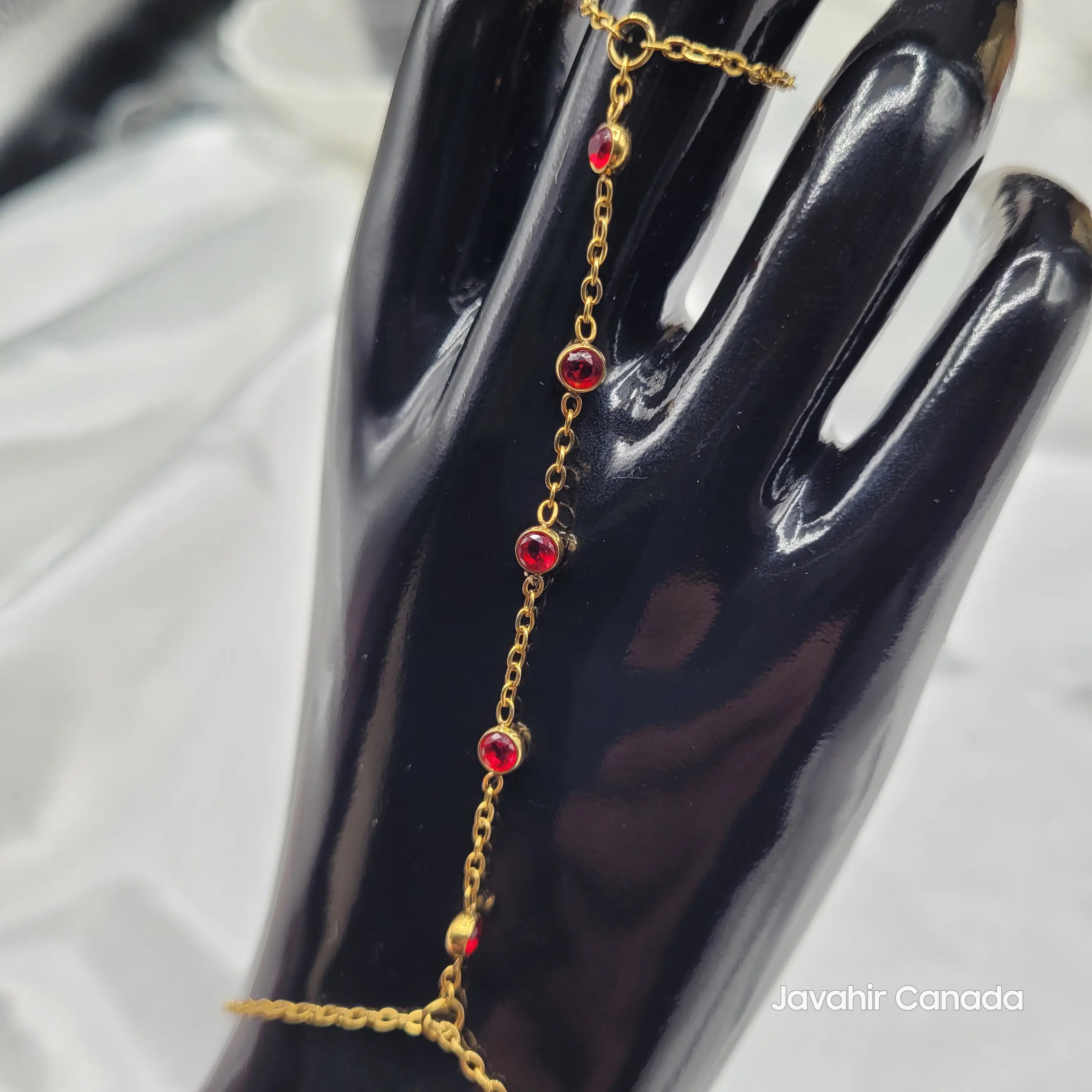 Gold chain with red crystals linked from ring to bracelet – JV4024