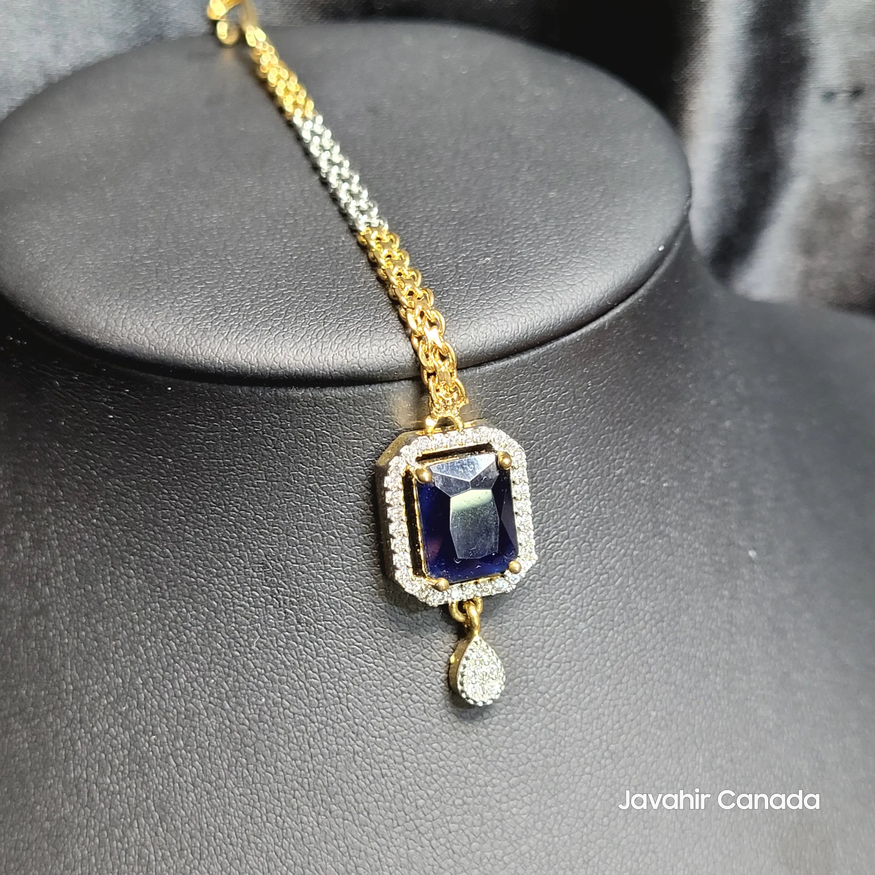 JV5200 gold-plated Teeka with blue sapphire and diamond halo