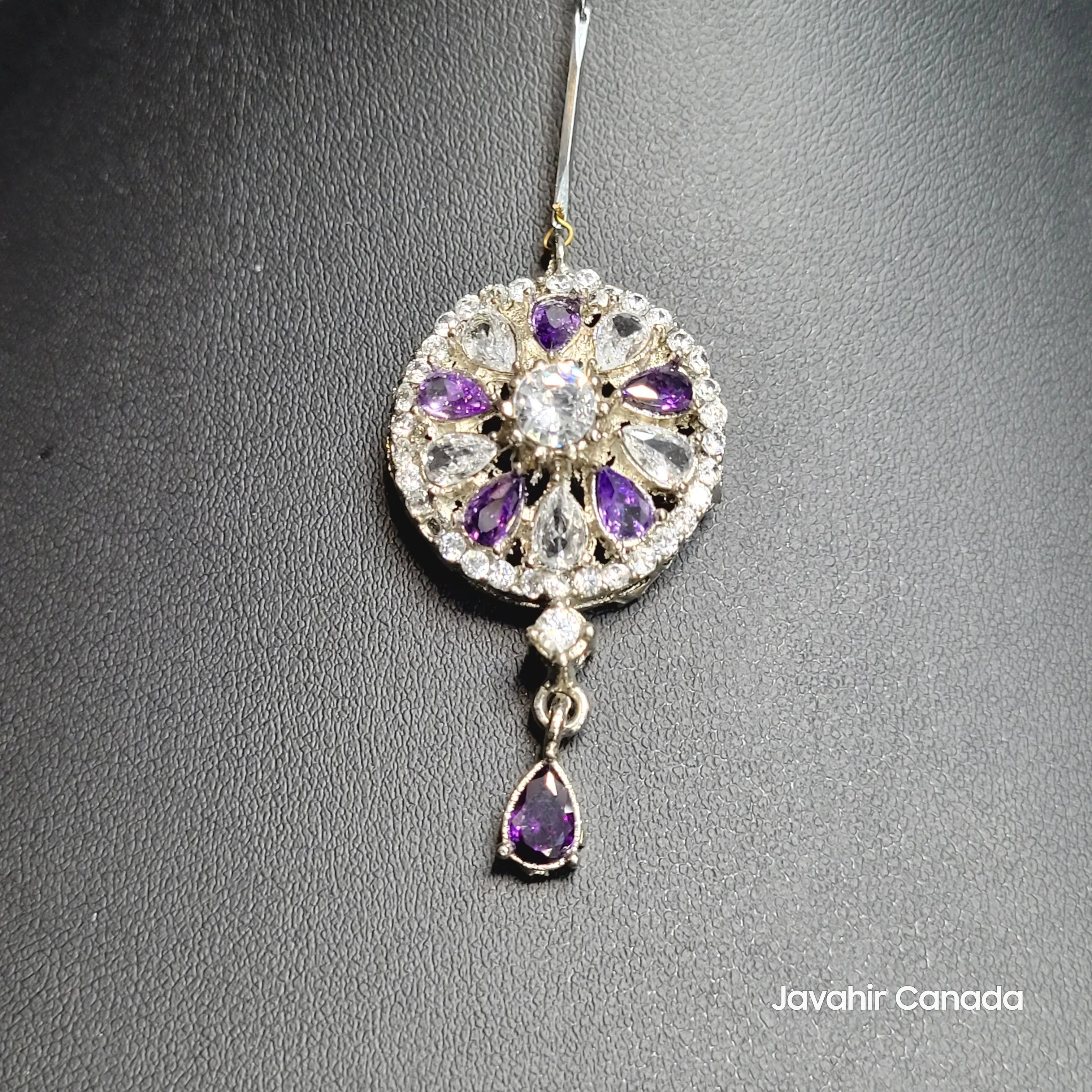 JV5204 circular Teeka with purple and clear stones