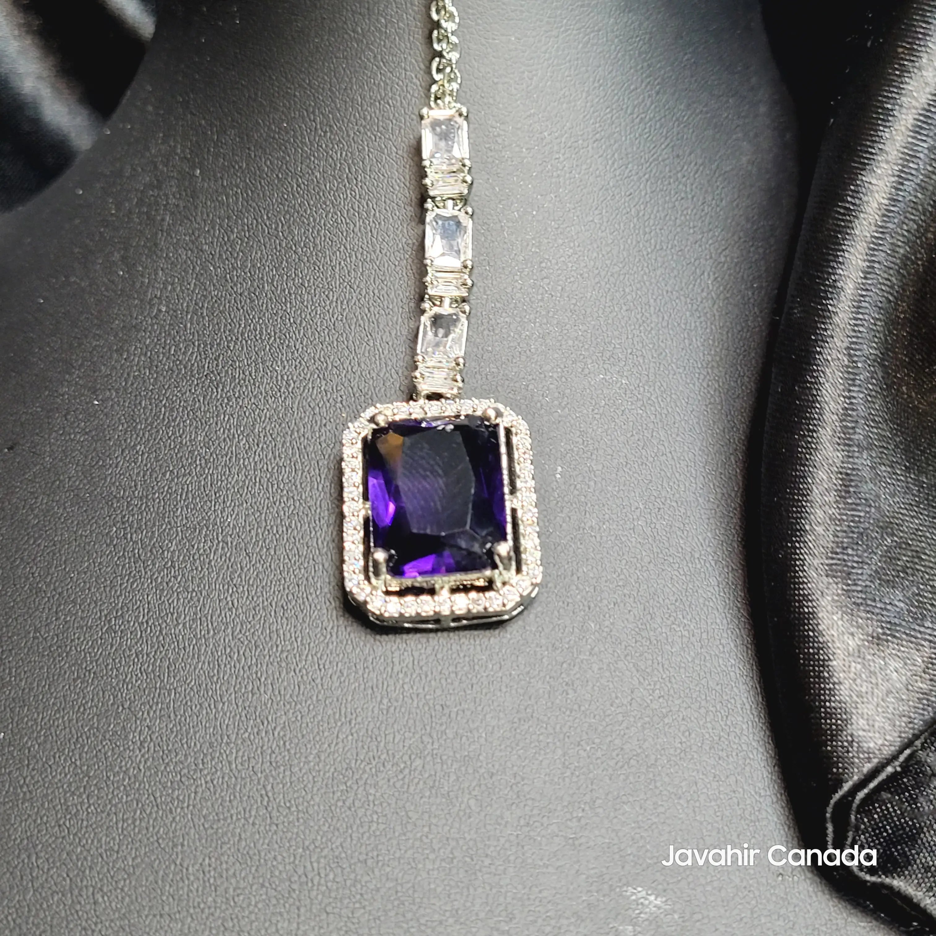 JV5210 Teeka with purple emerald-cut centerpiece