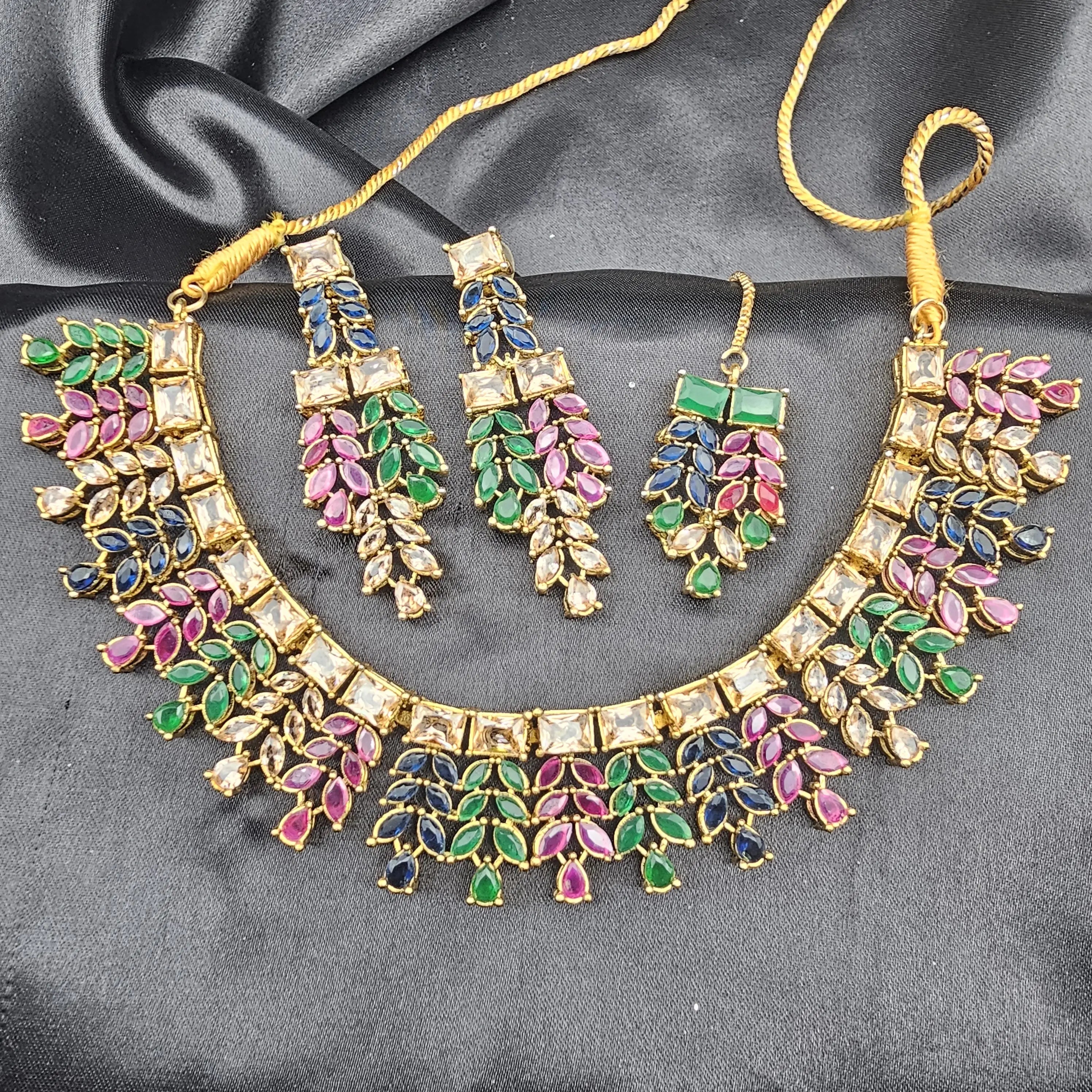 Bright top-view of Kaleidoscope set highlighting the ruby, emerald, sapphire, and champagne stones.