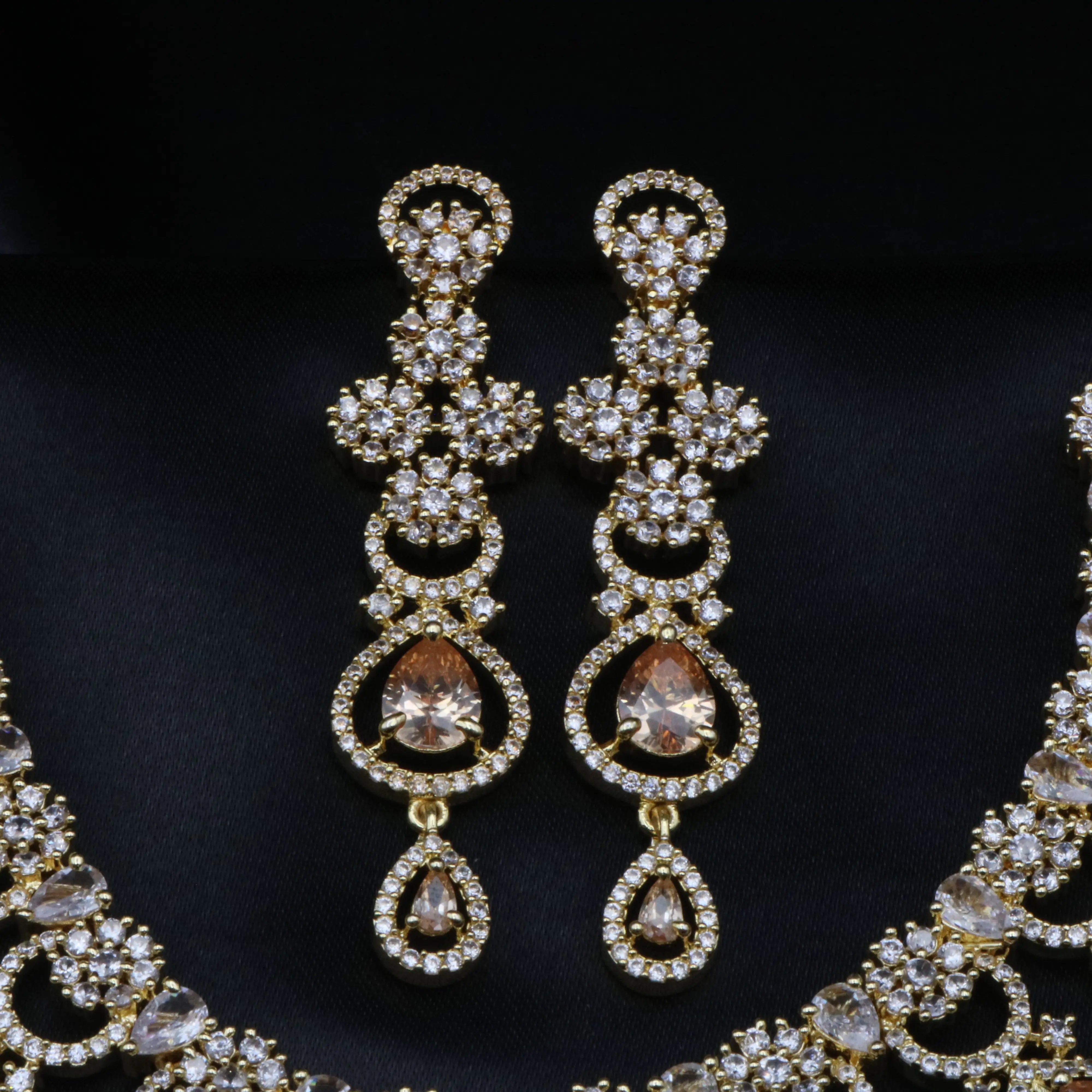 Chandelier earrings from Luxurious set with champagne CZ drops and diamond-studded hoops