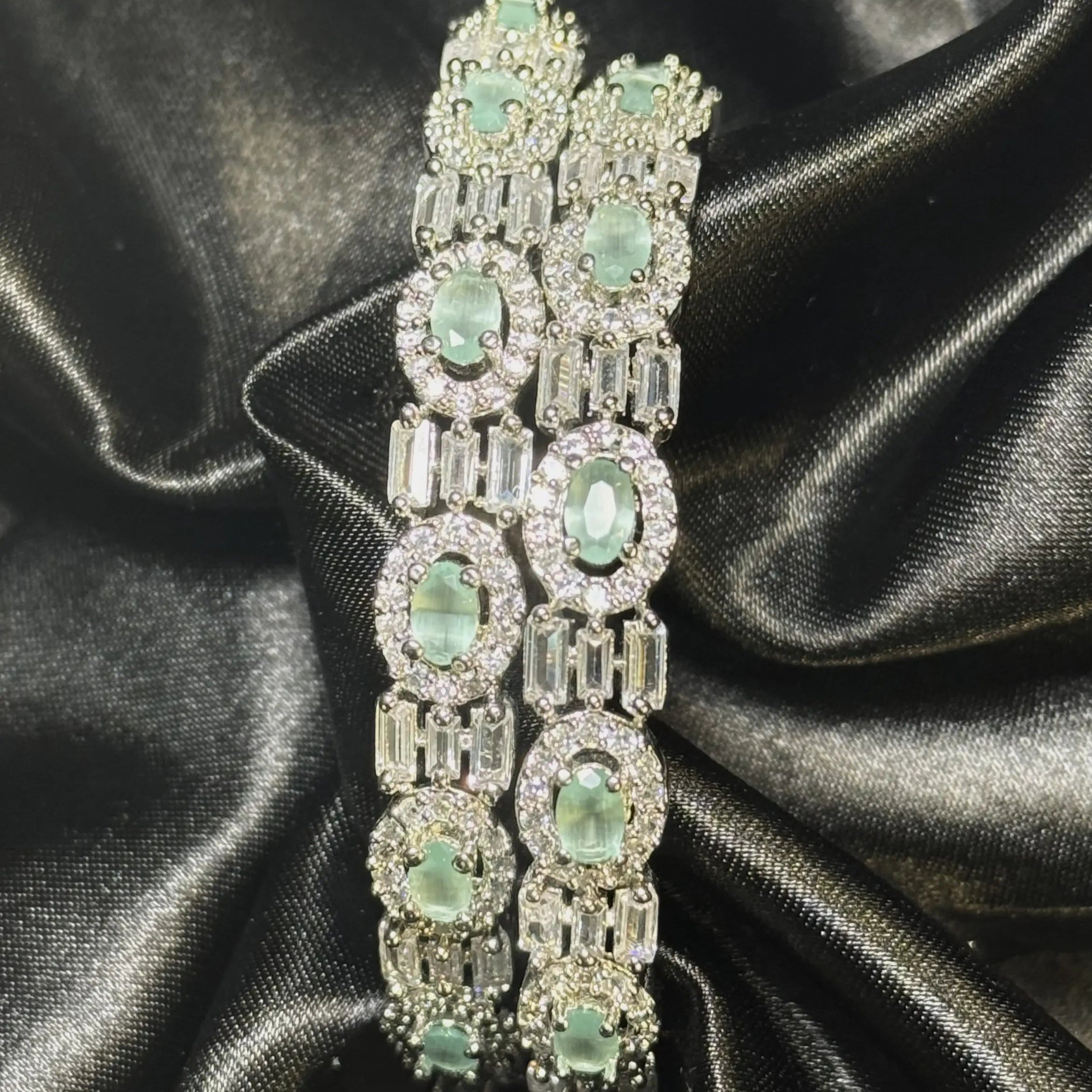 Silver Pakistani bangles with teal oval stones and crystal detailing