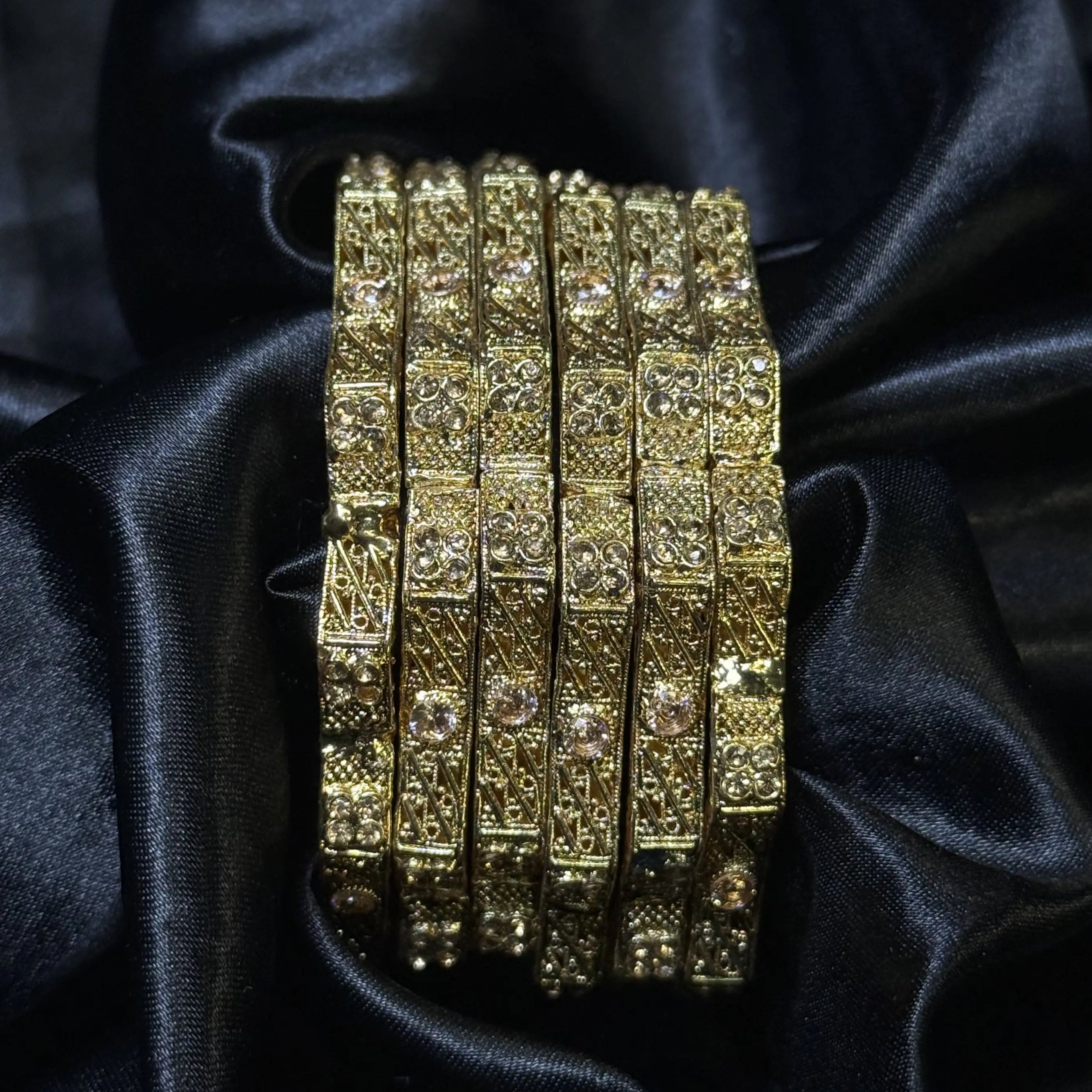 Traditional Indian gold bangles with crystal accents