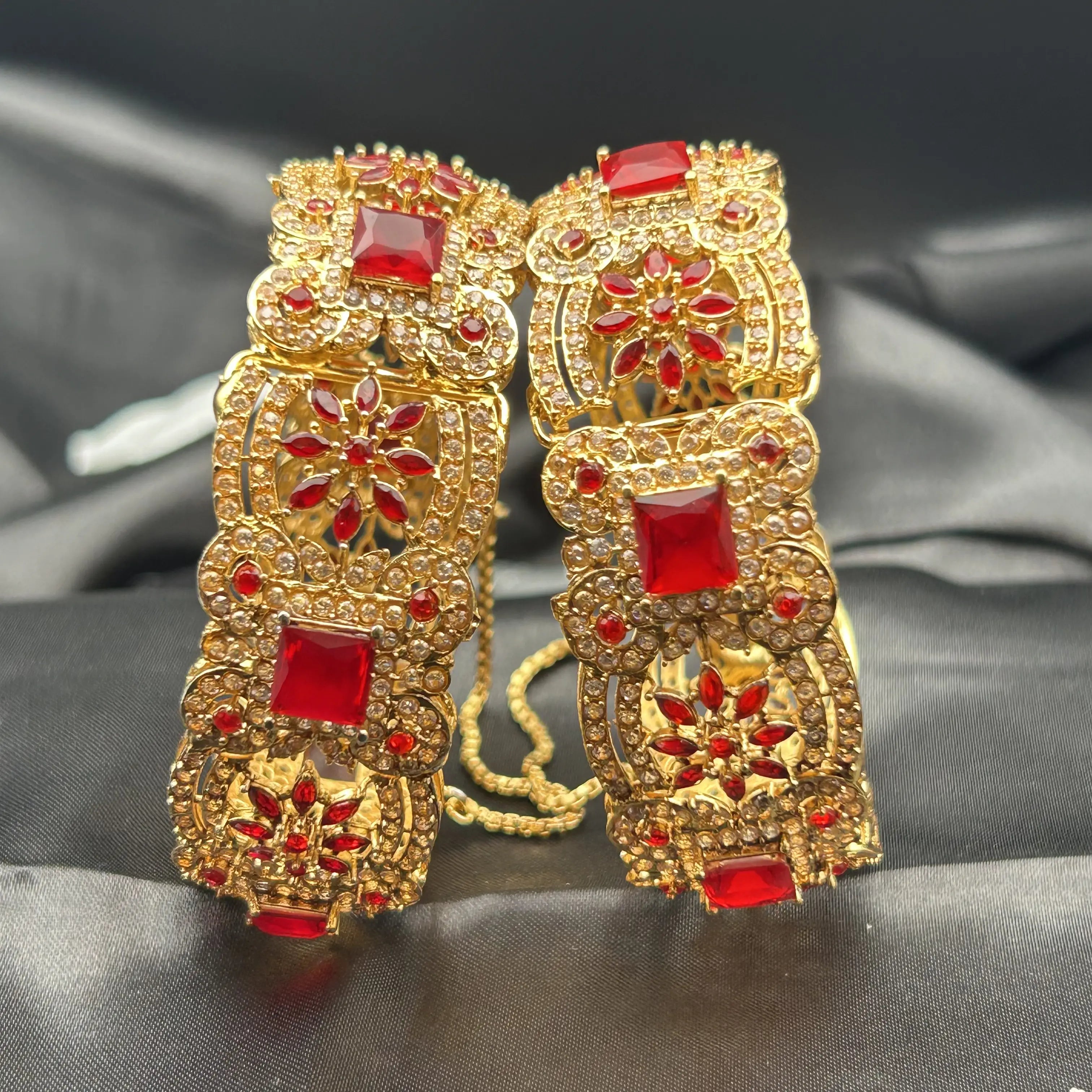 Redstone bangles with square red stones and floral CZ design – front view