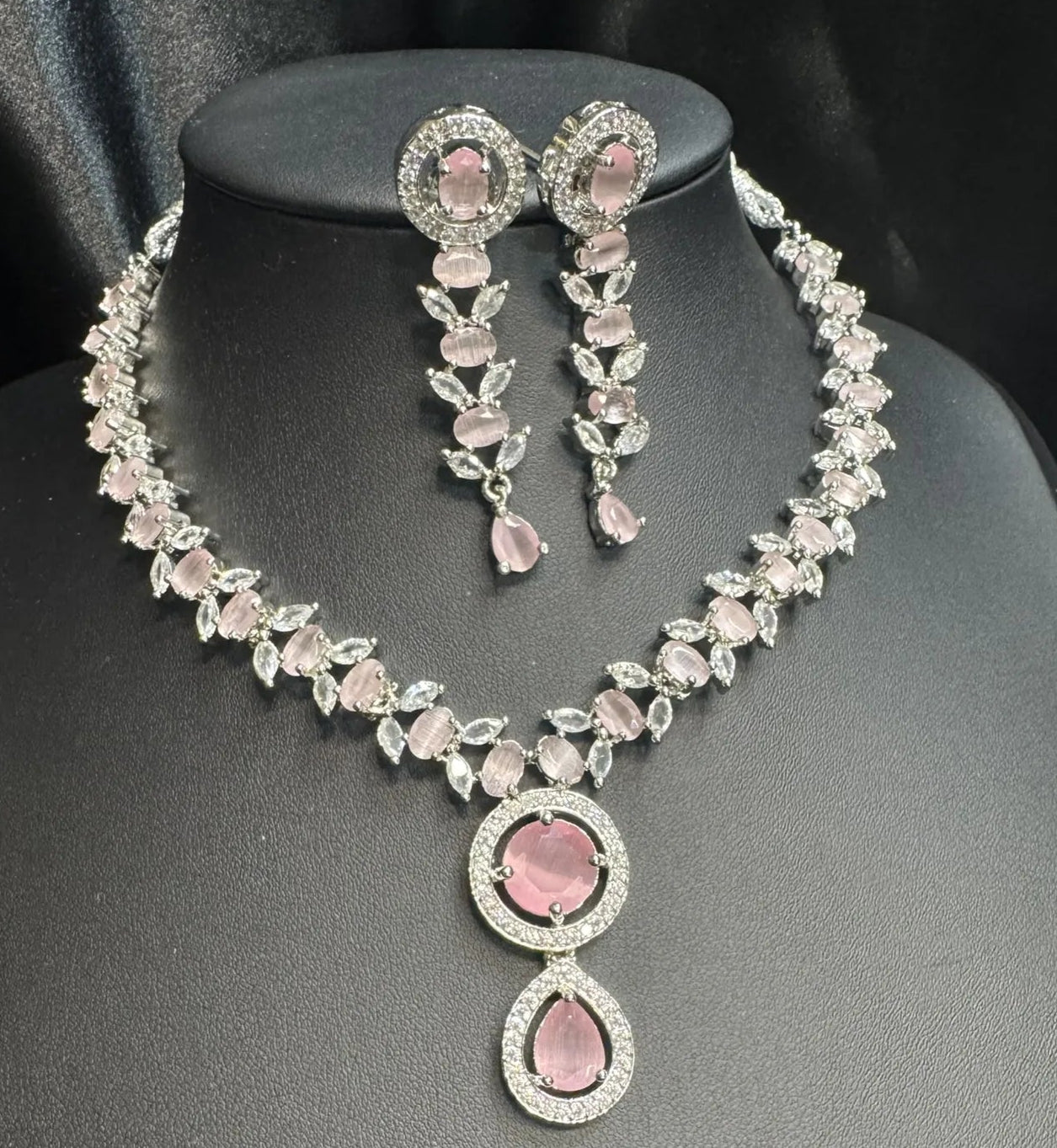 Jewelry set with necklace and earrings on a black mannequin