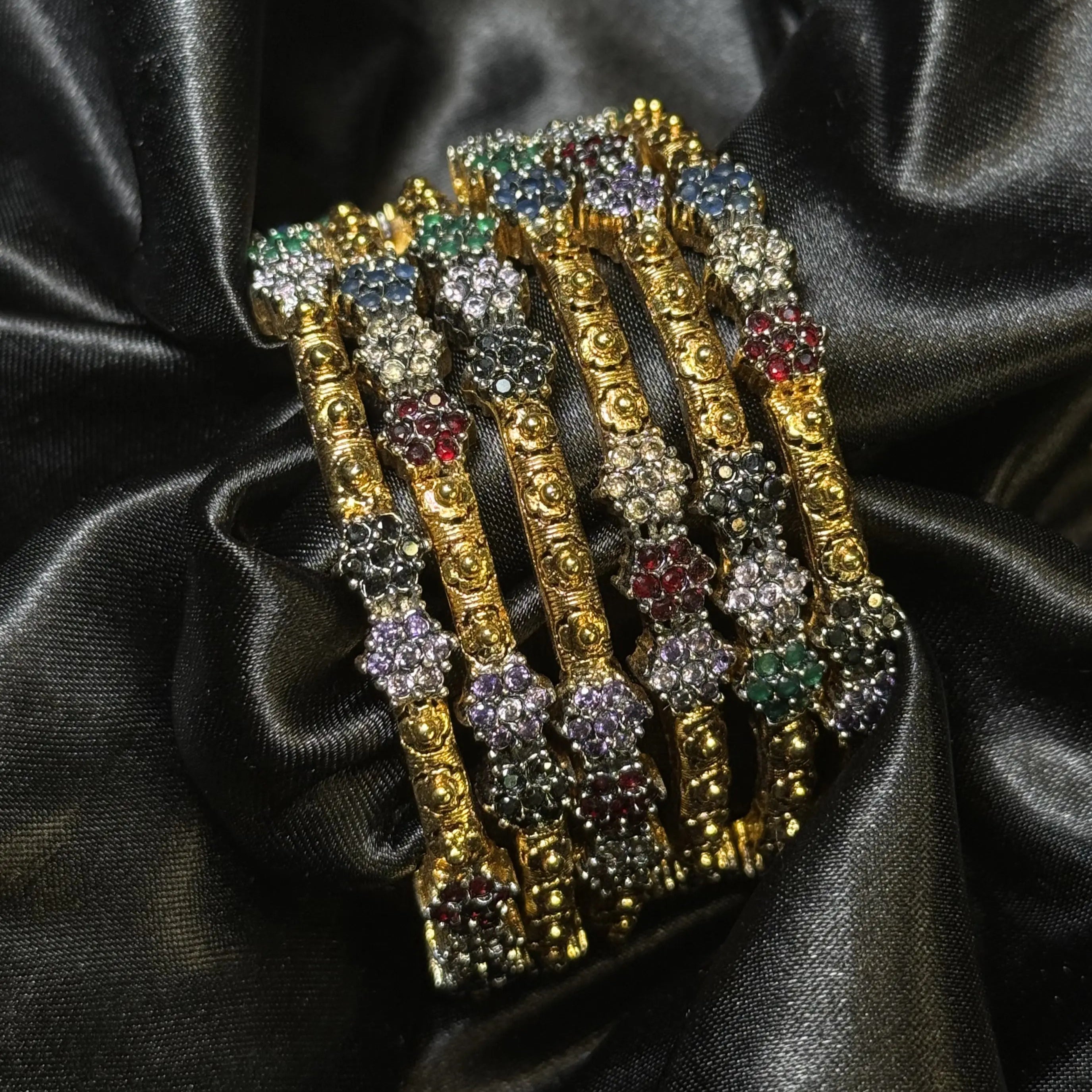 Antique gold plated bangles with colorful floral stones for festive wear